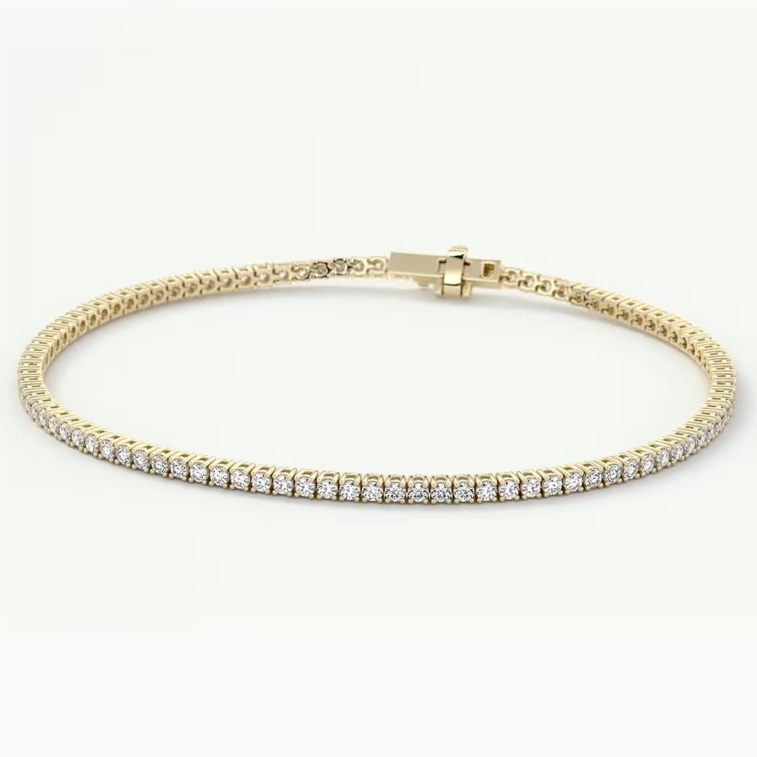 A yellow gold tennis bracelet with a row of clear round-cut gemstones, displayed on a clean white background.