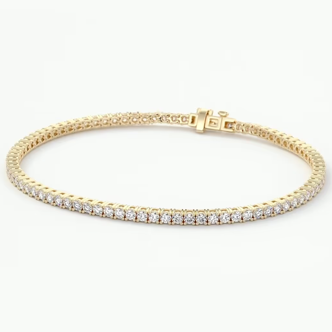 A yellow gold tennis bracelet featuring a single row of sparkling clear gemstones, displayed on a clean white background.