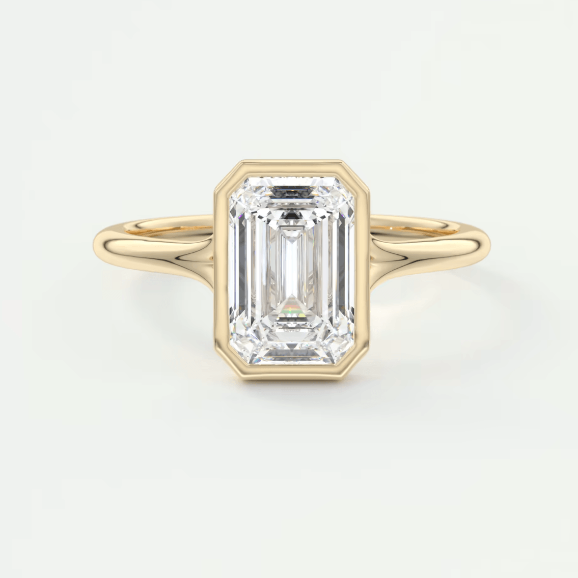 18k yellow gold emerald cut diamond engagement ring.
