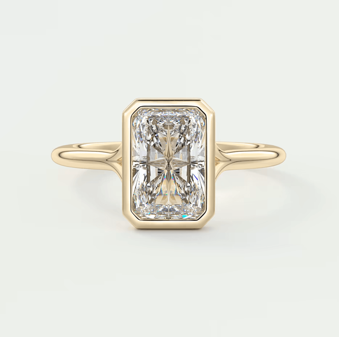 18k yellow gold engagement ring with a radiant cut diamond.