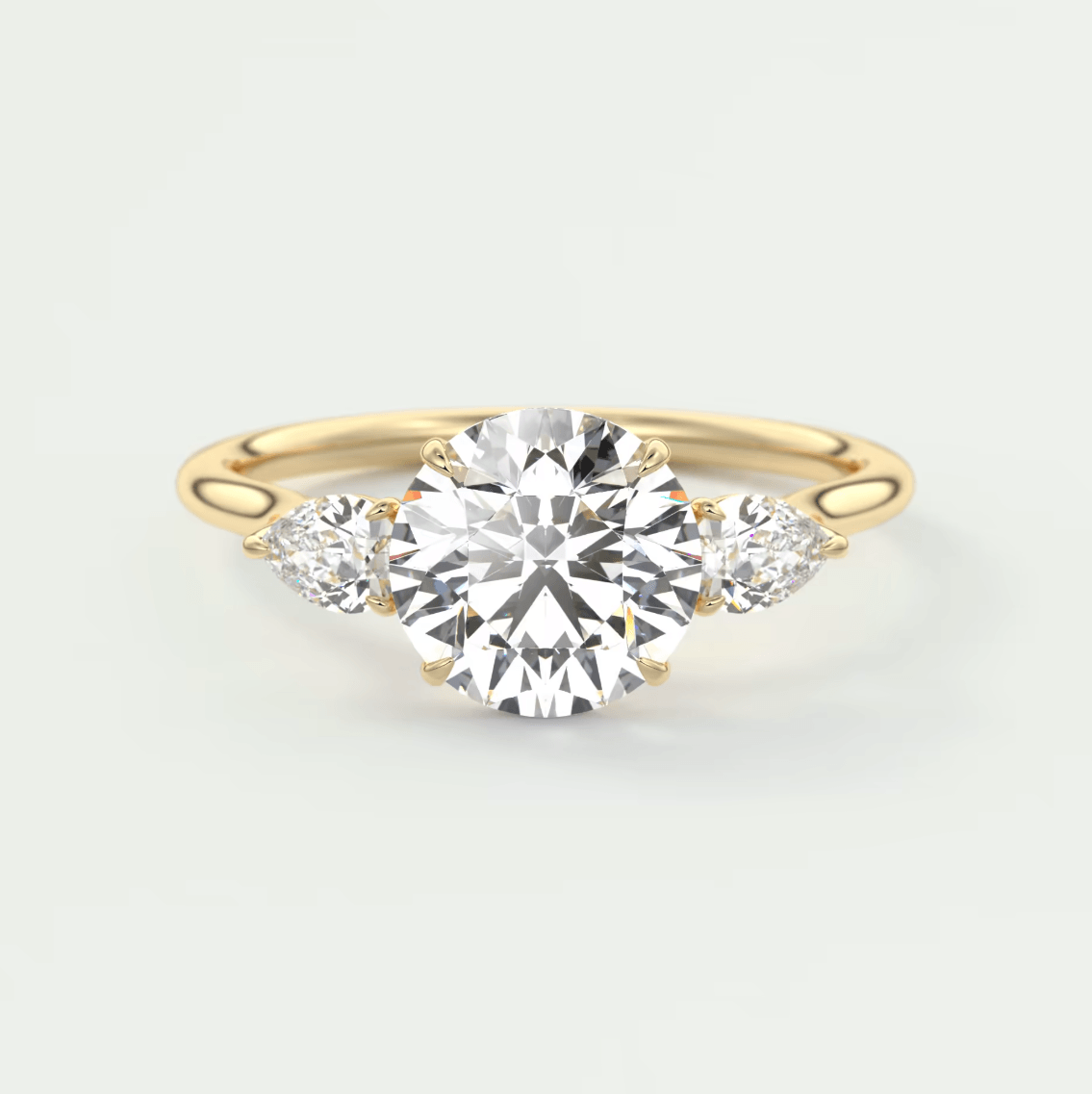 18k yellow gold engagement ring with three round diamonds.