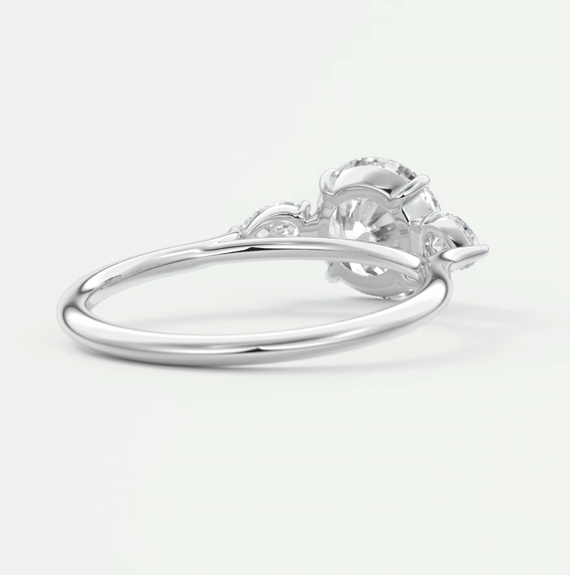 Silver diamond engagement ring with floral design and claw setting.