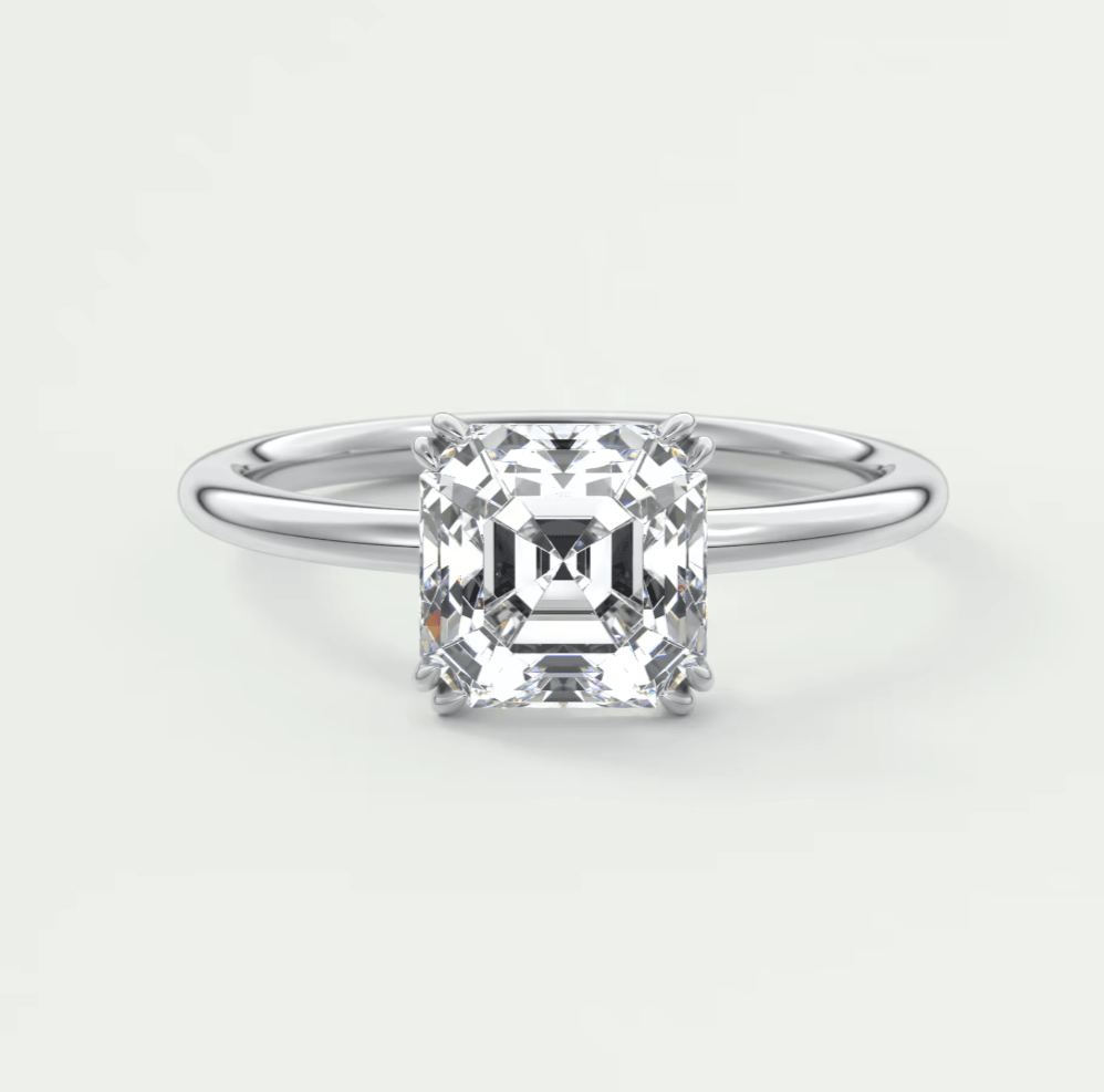 Princess cut diamond engagement ring with a white gold band.