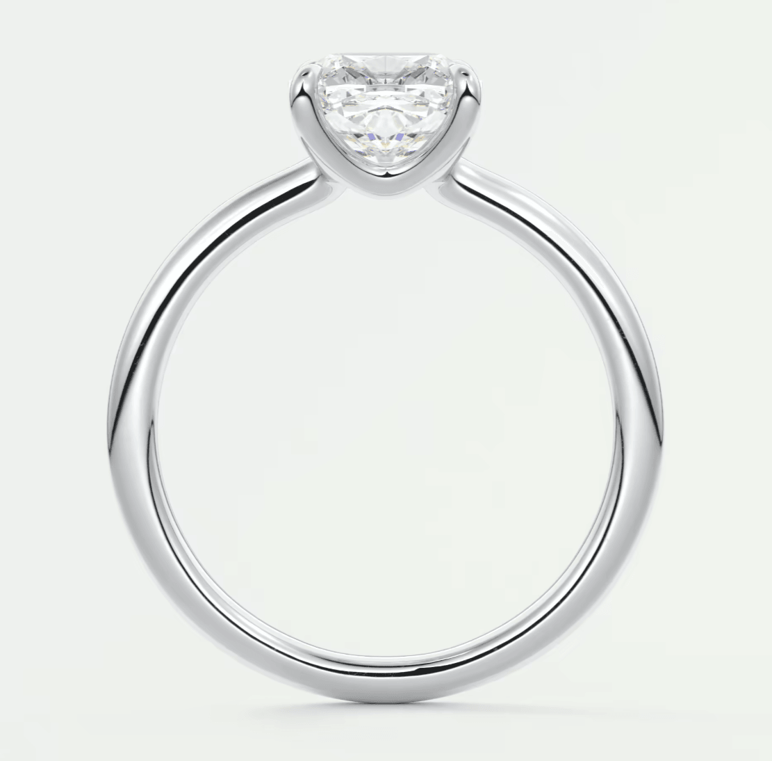 18-karat white gold engagement ring with a princess-cut diamond.