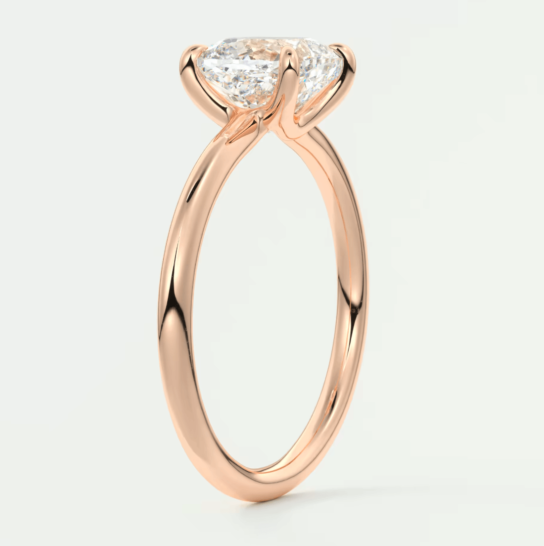 18k rose gold engagement ring with a princess cut diamond.