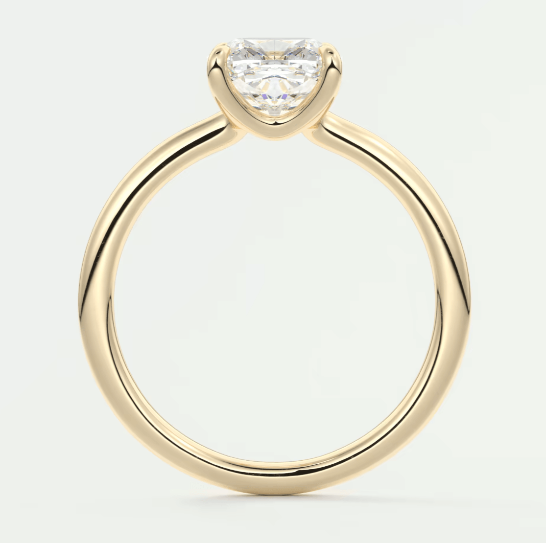18k yellow gold solitaire engagement ring with a princess cut diamond.