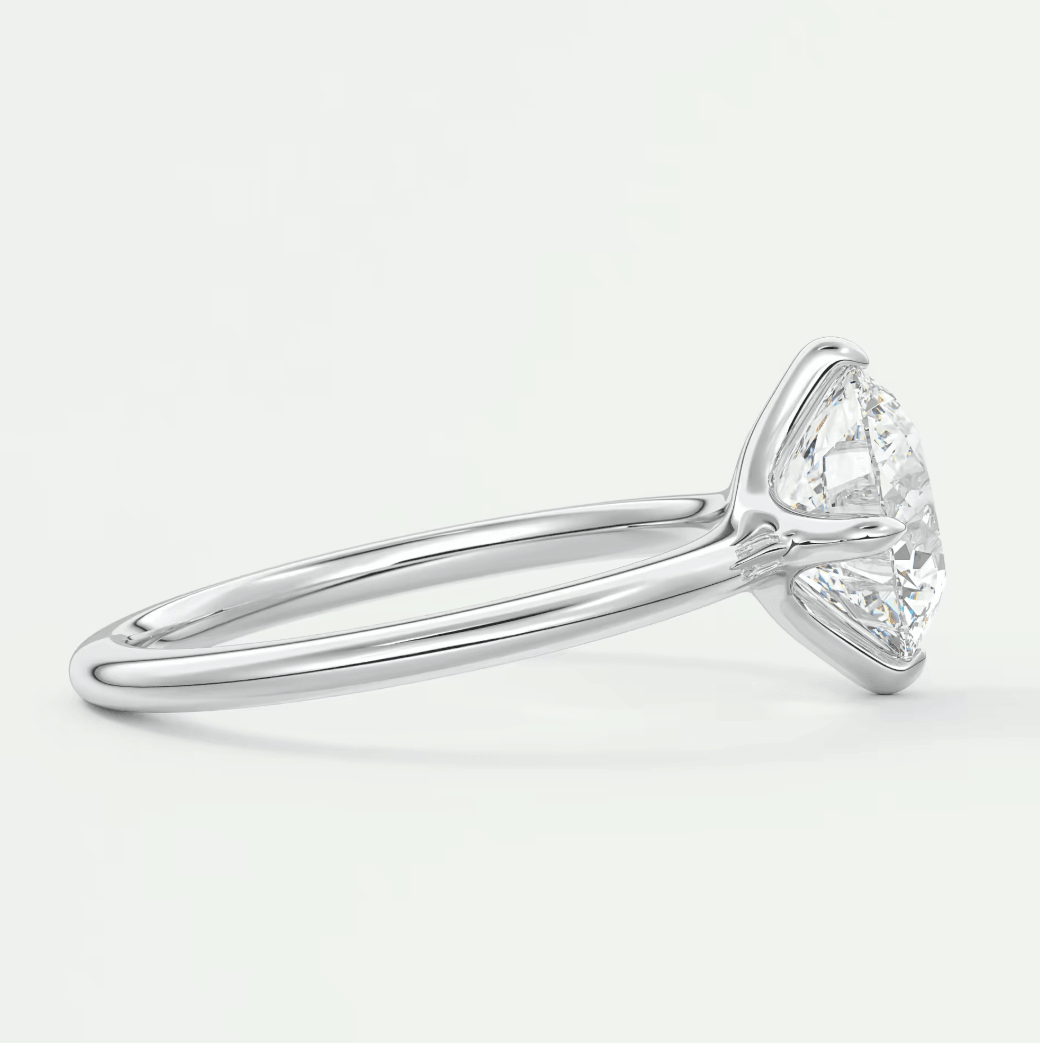 18-karat white gold engagement ring with a marquise-cut diamond.