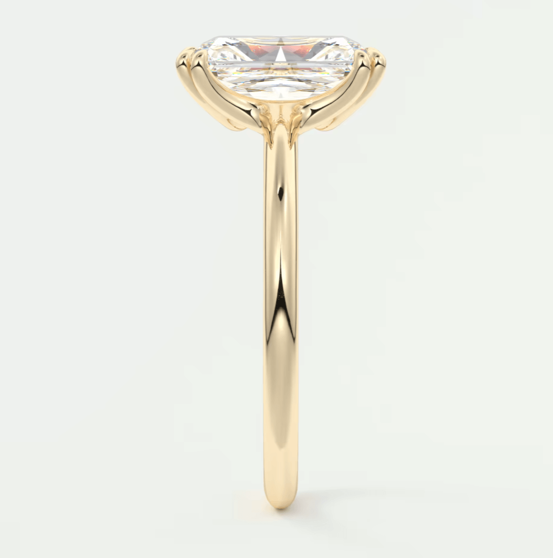 18k yellow gold engagement ring with a princess cut diamond.