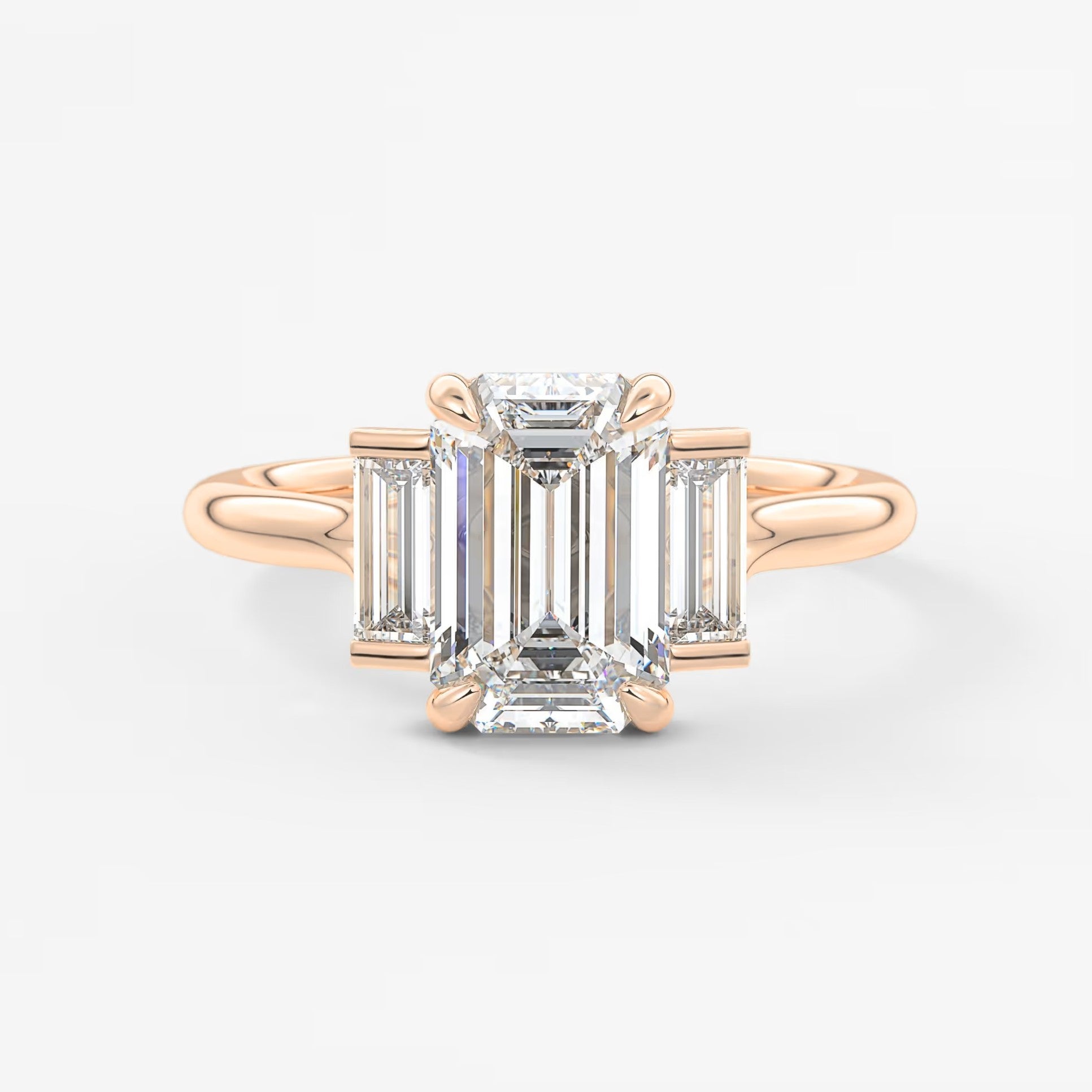 Aureline emerald baguette trilogy engagement ring