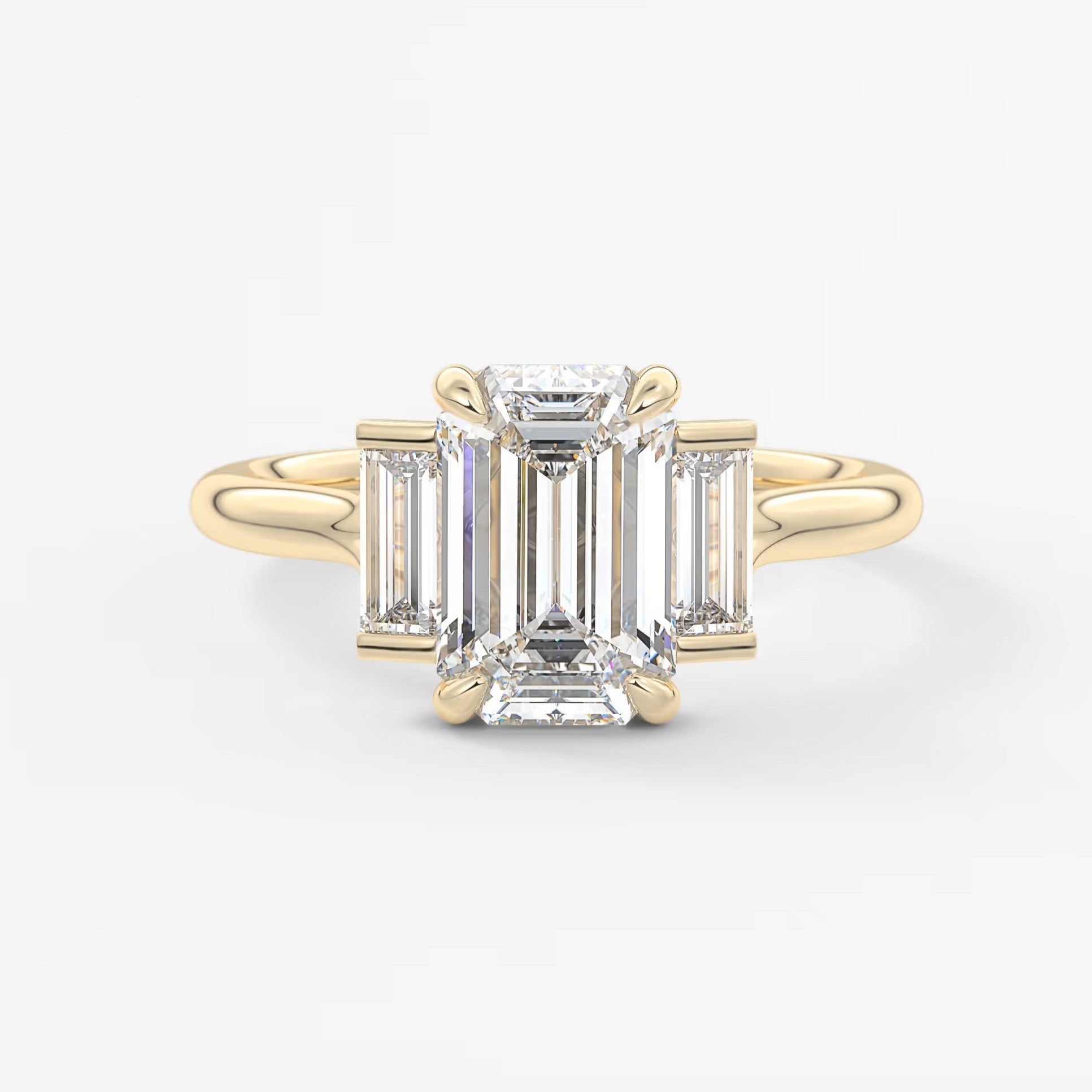 Aureline emerald baguette trilogy engagement ring