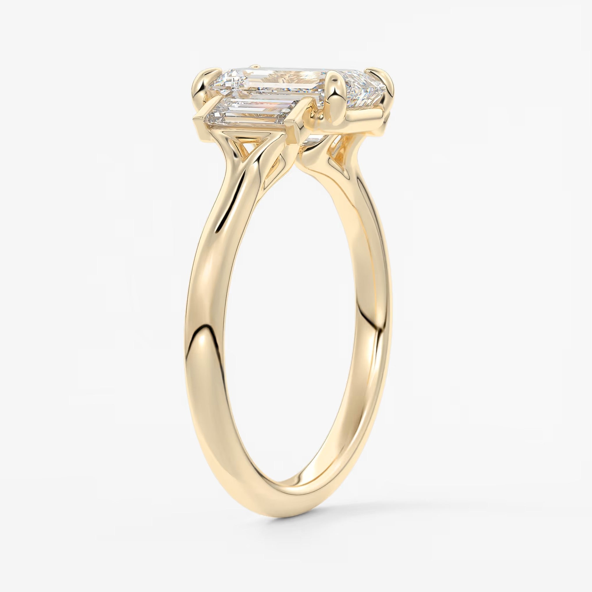 Aureline emerald baguette trilogy engagement ring