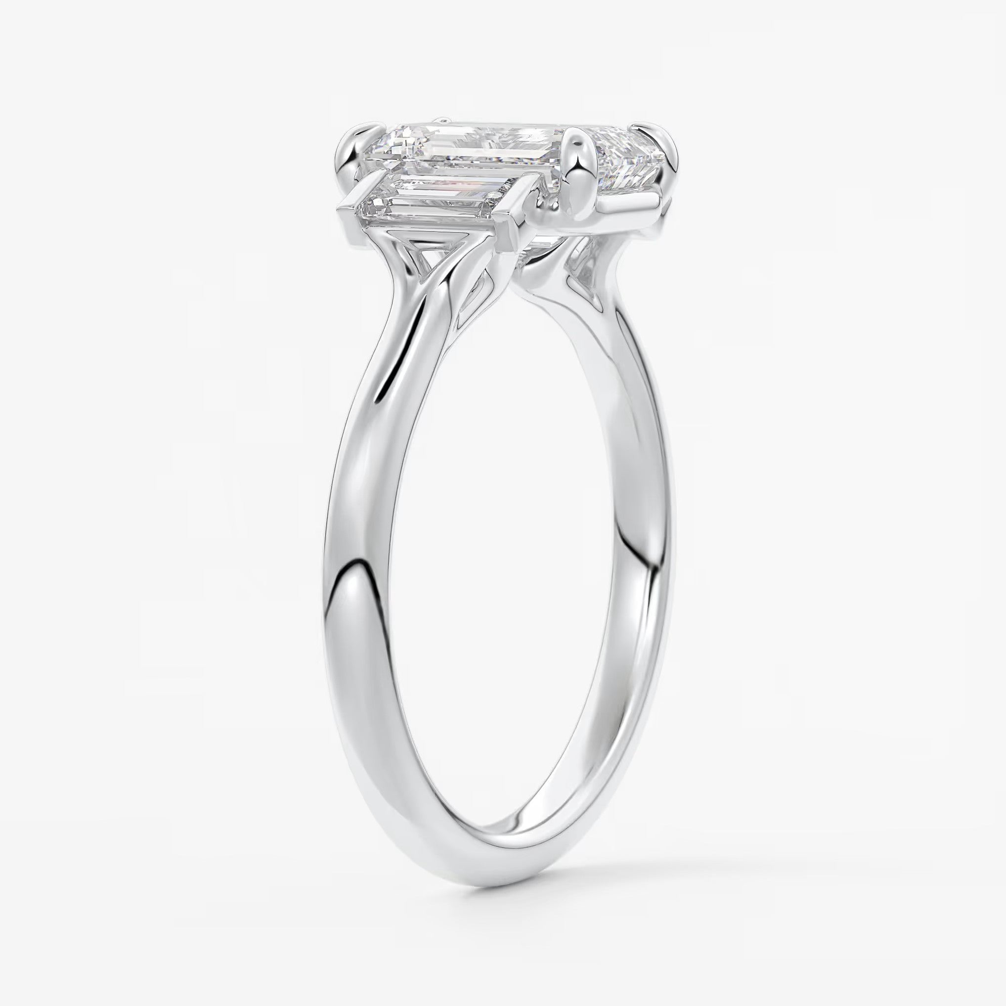 Aureline emerald baguette trilogy engagement ring