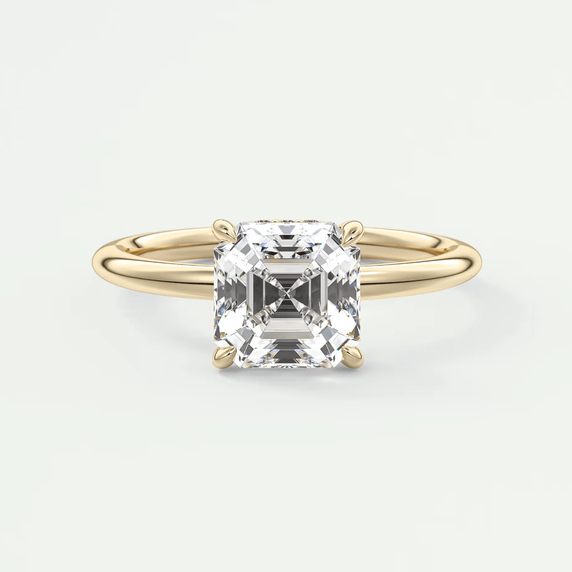 18k yellow gold engagement ring with a princess cut diamond.
