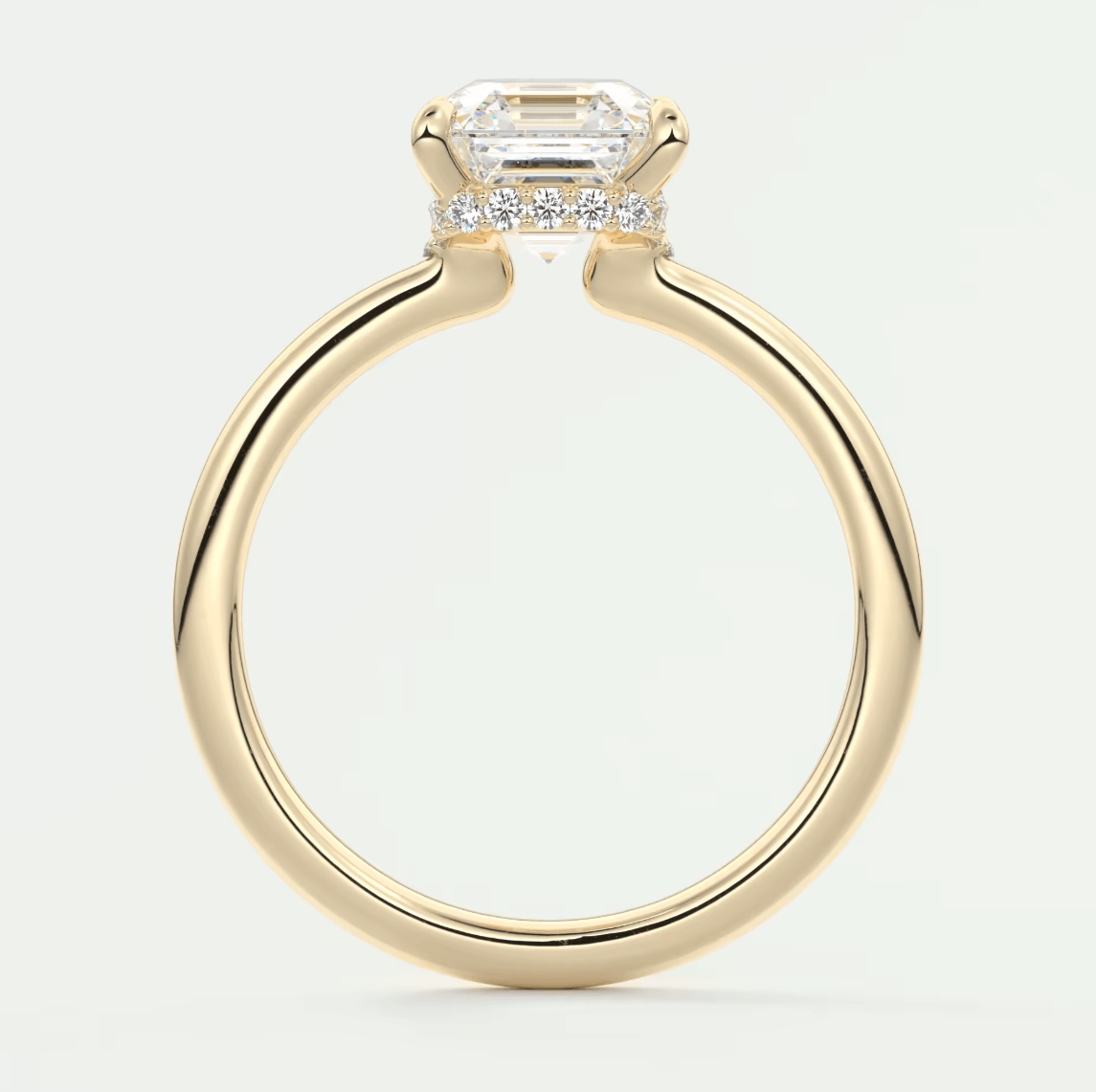 18k yellow gold emerald cut diamond engagement ring.