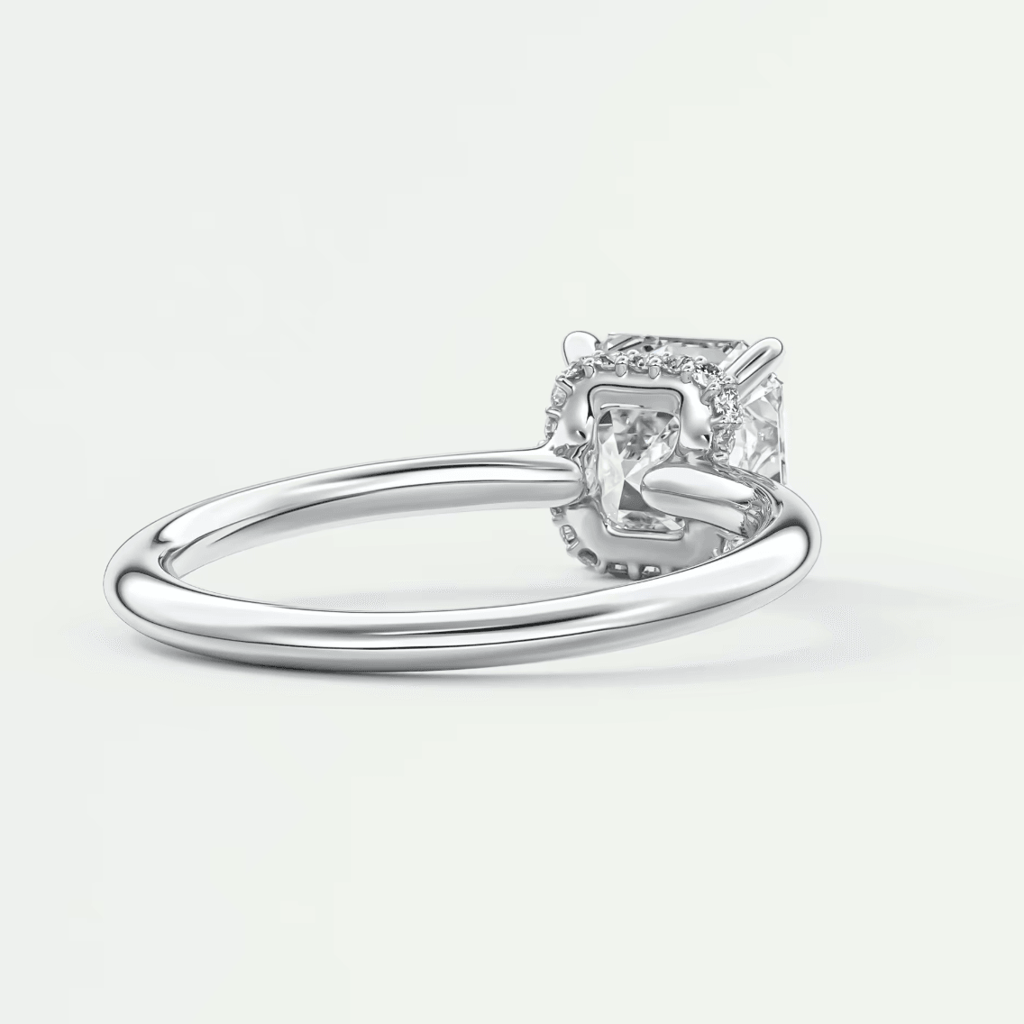 Princess cut diamond engagement ring with white gold band and prong setting.