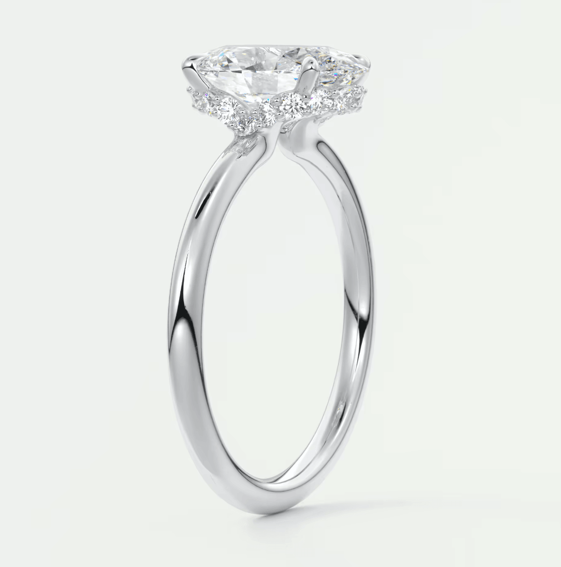 18k white gold diamond engagement ring with a cushion-cut center stone and halo design.
