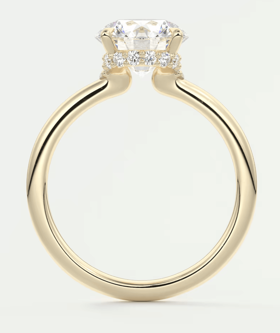 18k yellow gold engagement ring with princess cut diamond and small side diamonds.