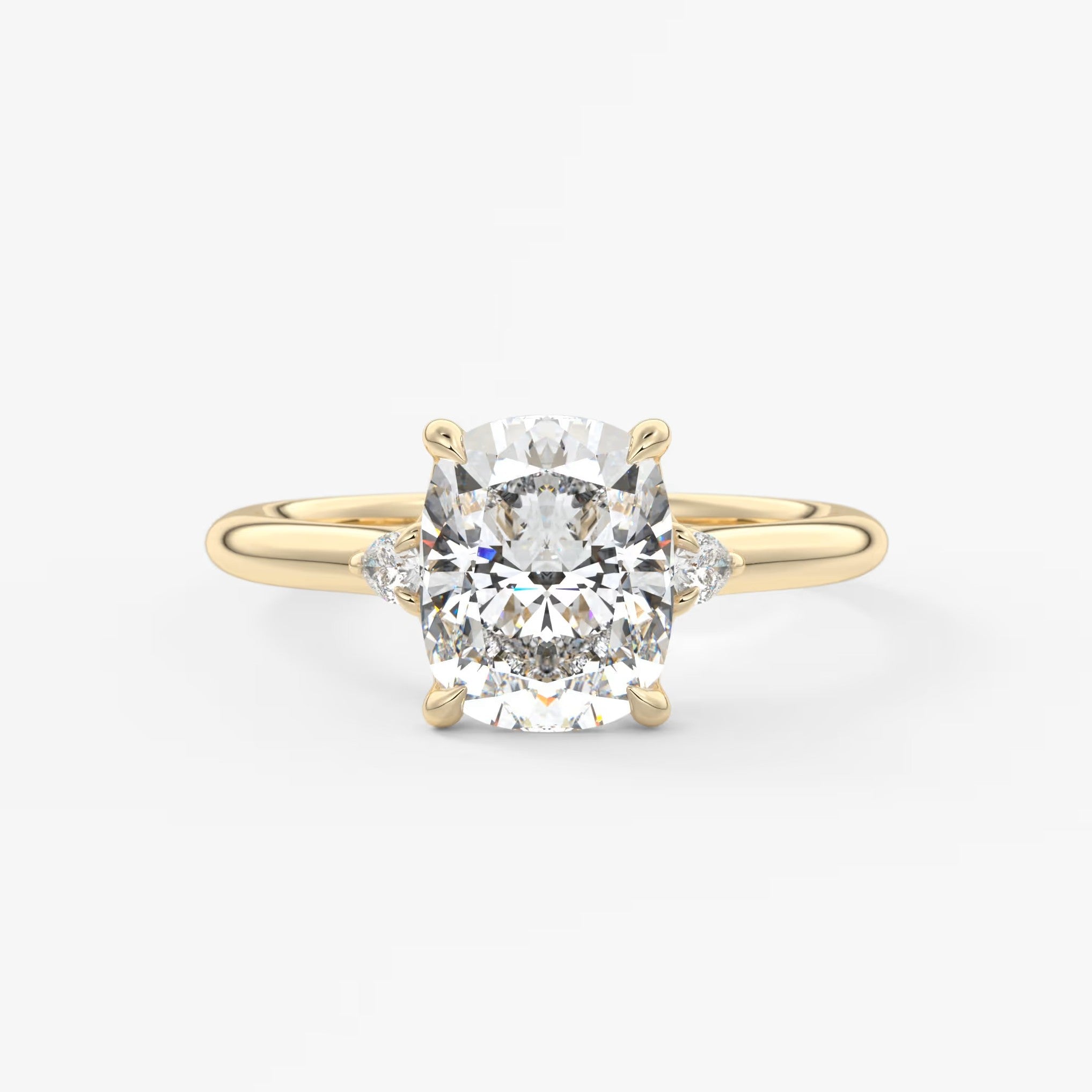 Cassia – cushion trilogy with pear side stones