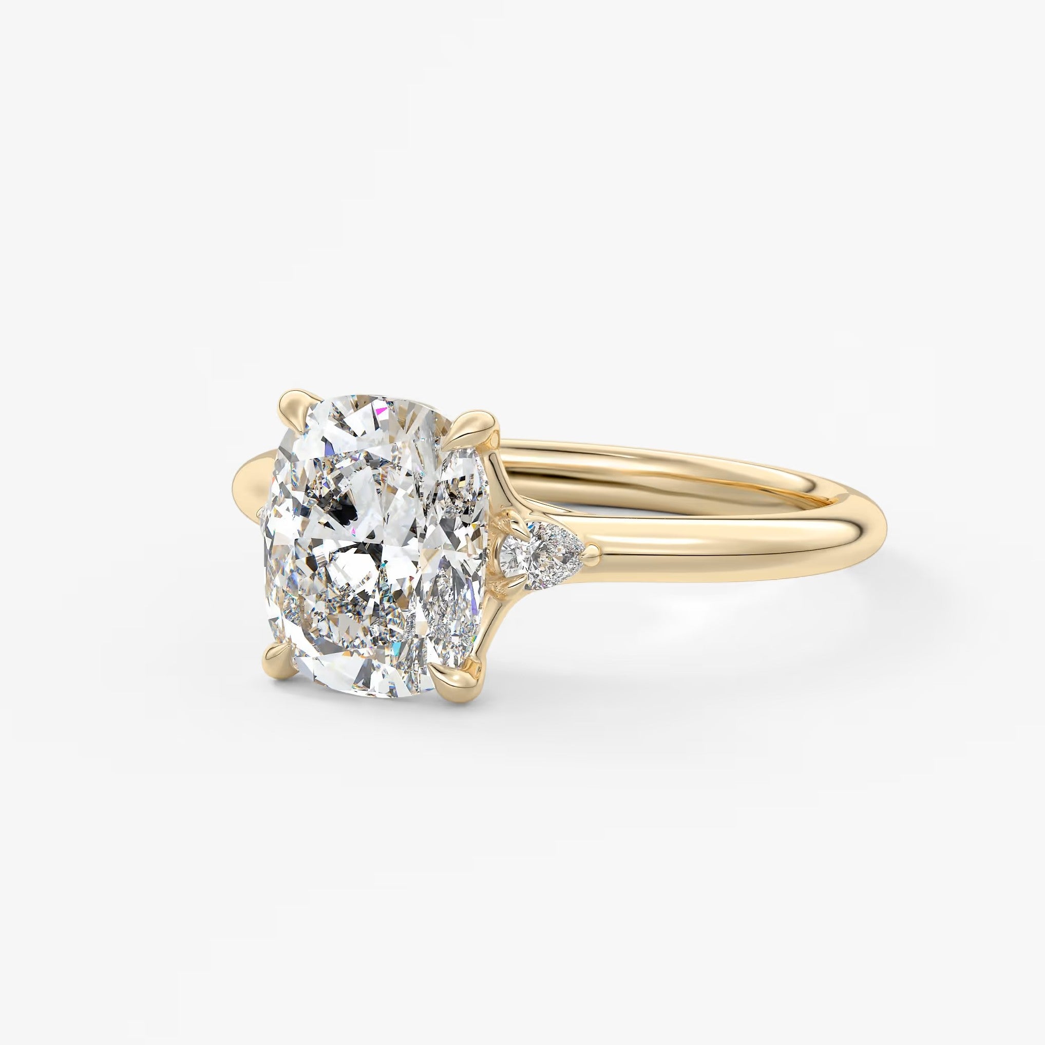 Cassia – cushion trilogy with pear side stones