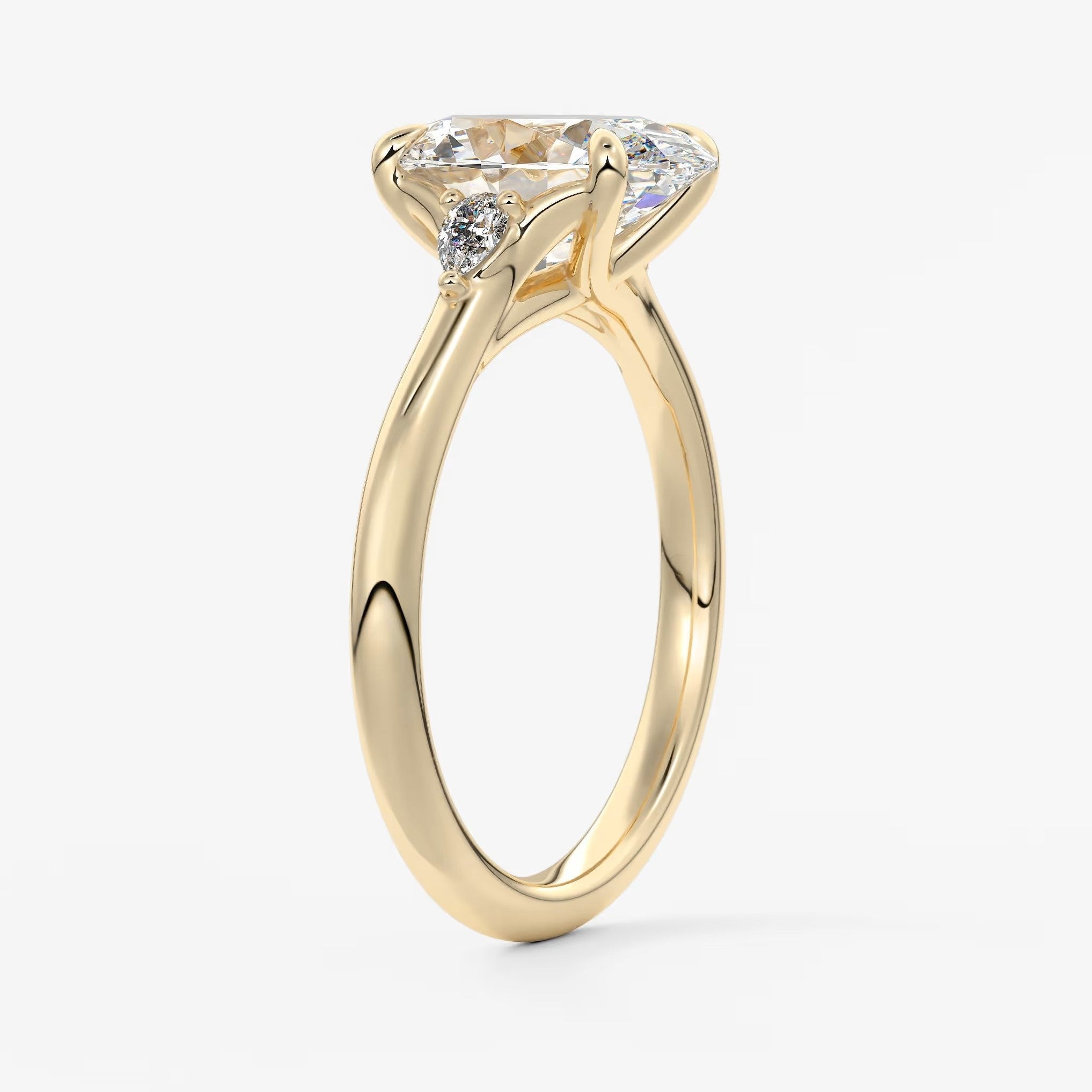 Cassia – oval trilogy with pear side stones