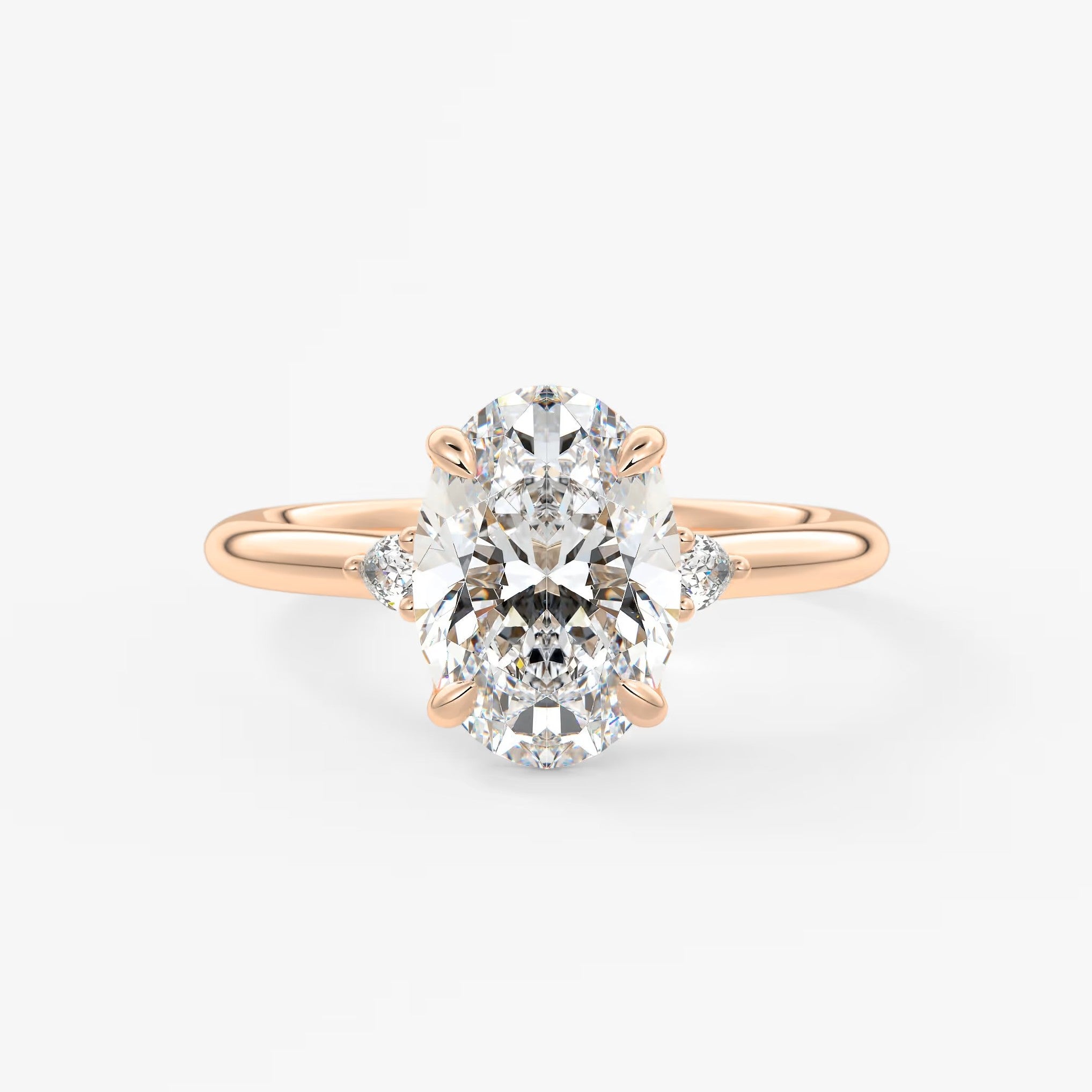 Cassia – oval trilogy with pear side stones