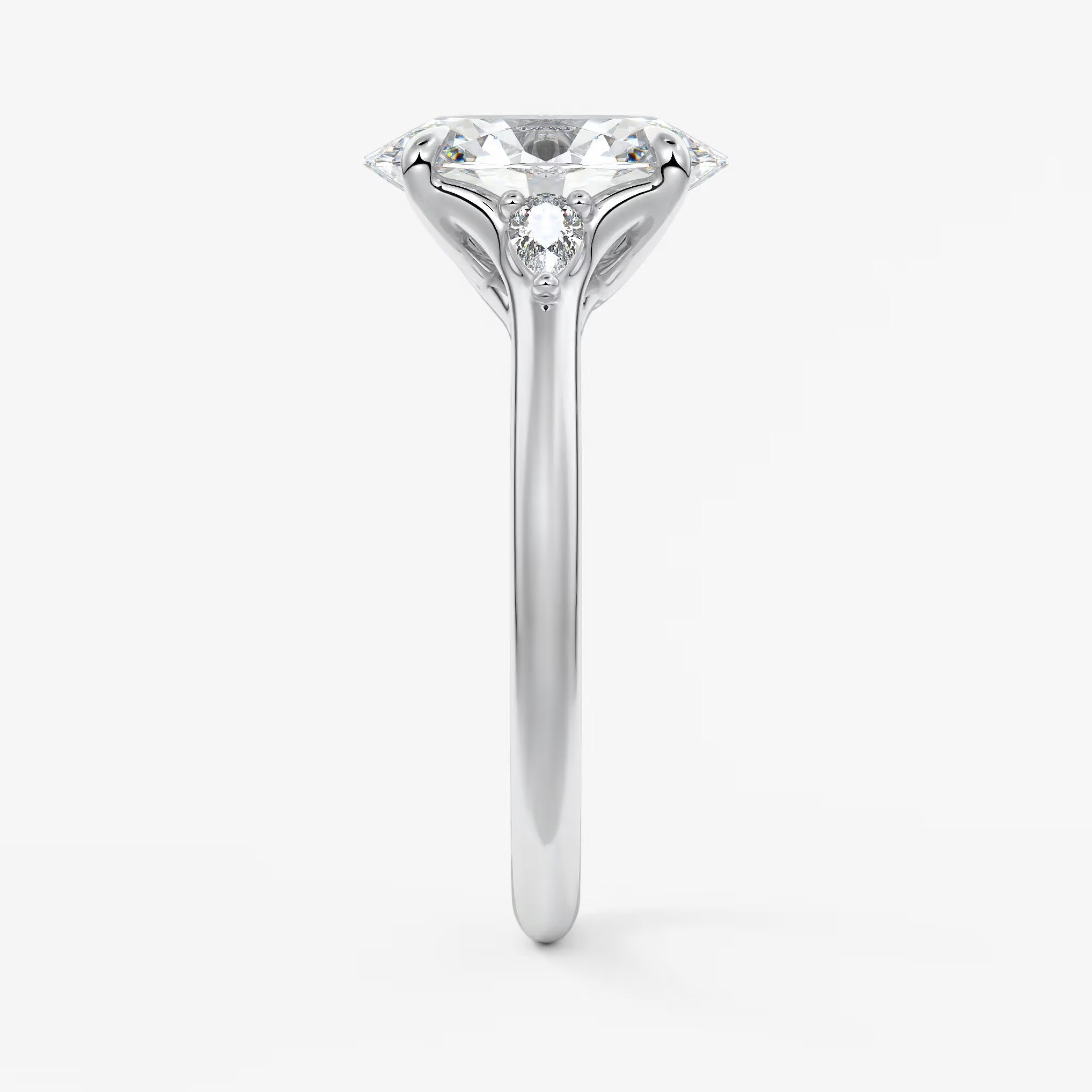 Cassia – oval trilogy with pear side stones