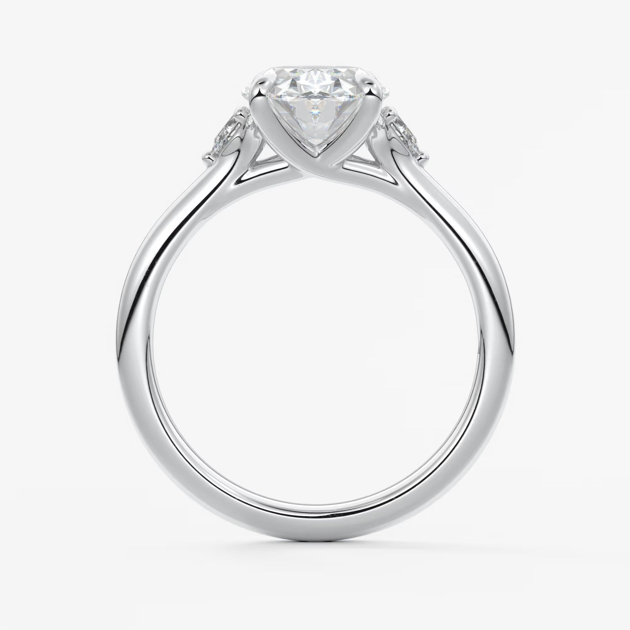 Cassia – oval trilogy with pear side stones