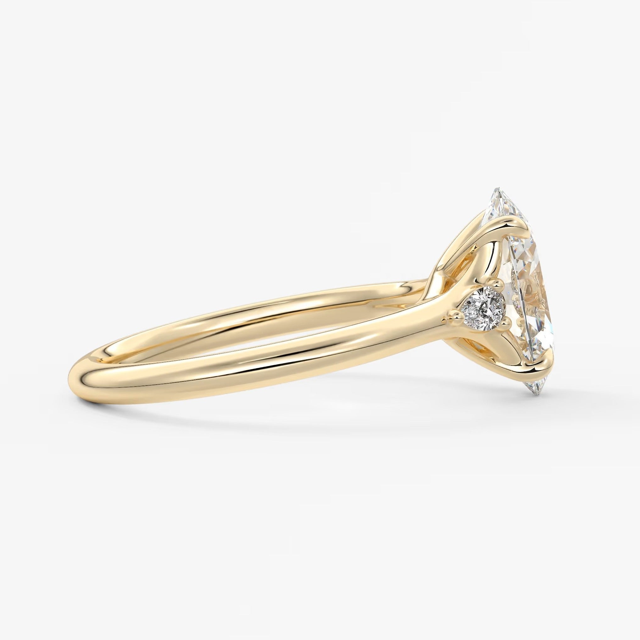 Cassia – oval trilogy with pear side stones