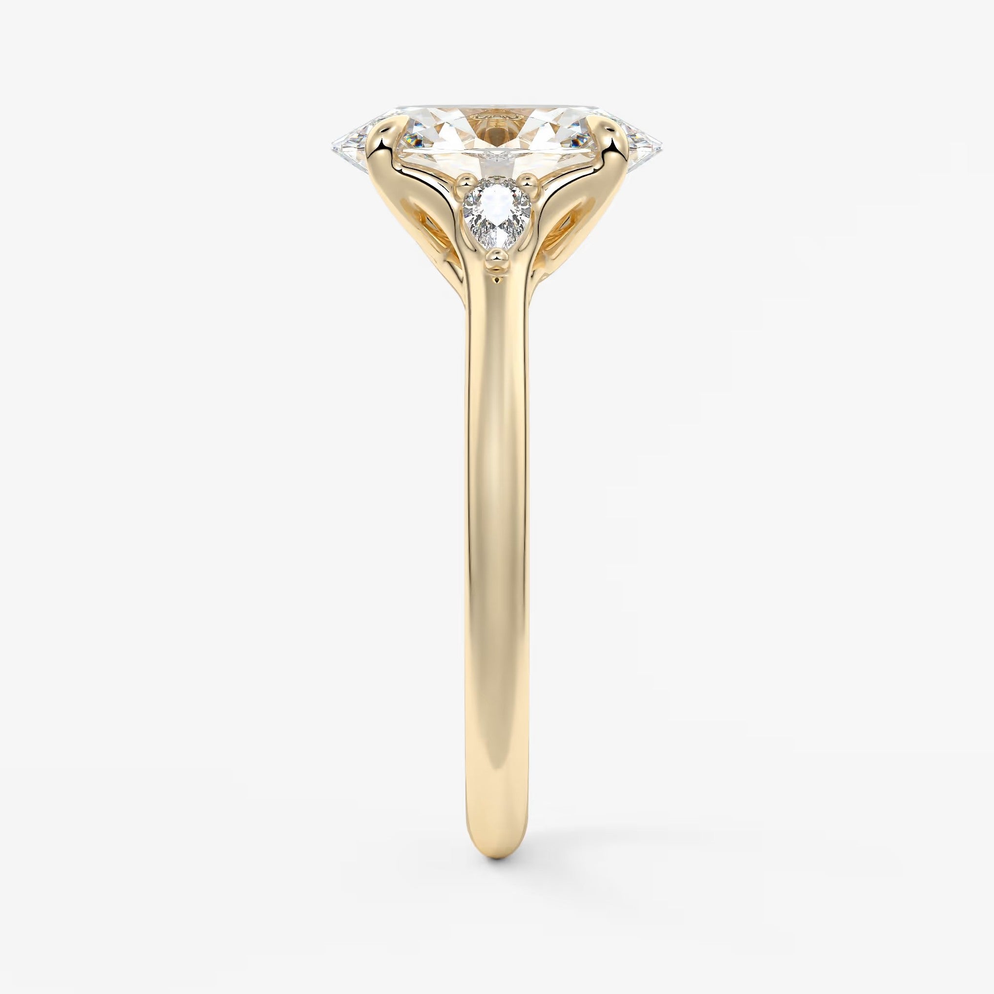 Cassia – oval trilogy with pear side stones