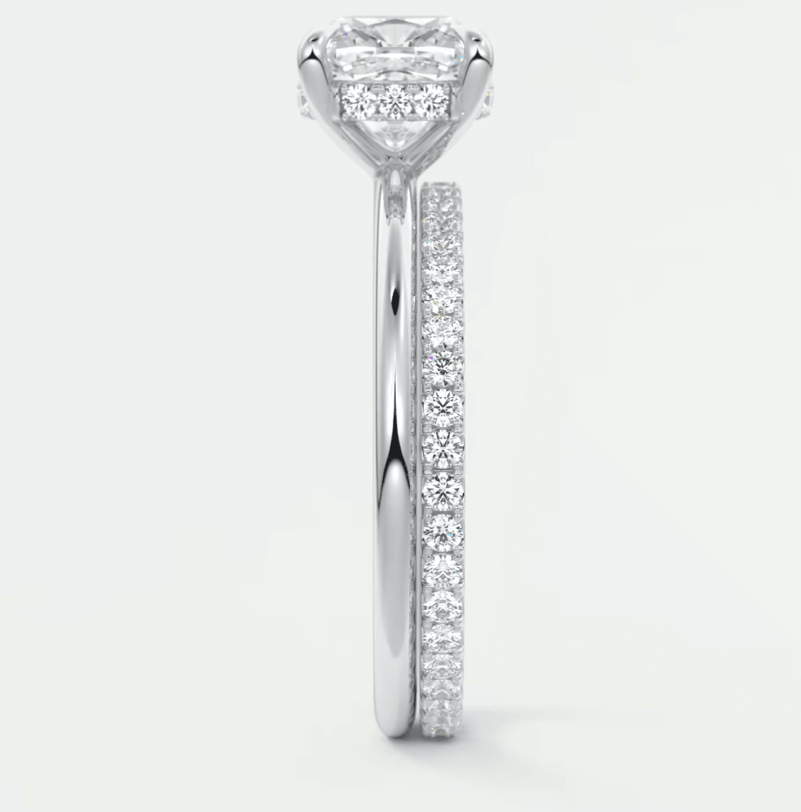 18k white gold princess cut diamond engagement ring with a pave band.