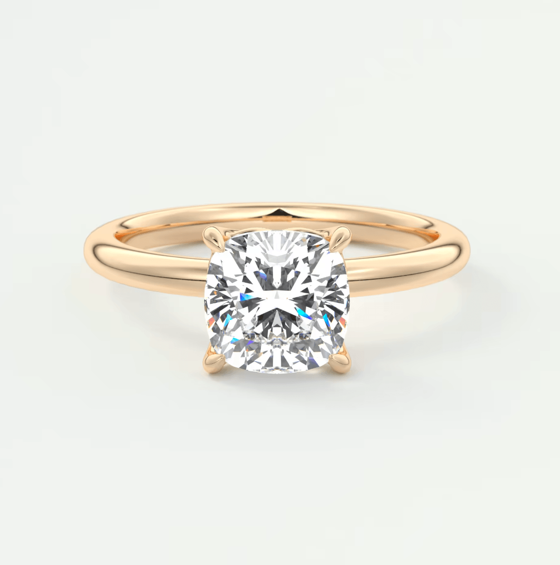 18k rose gold cushion-cut diamond engagement ring.