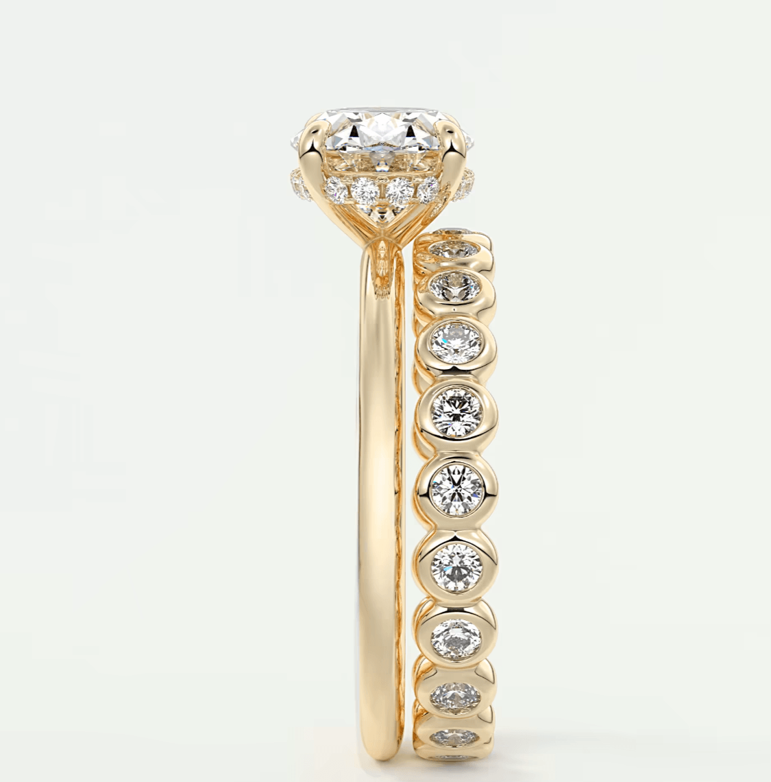 18k yellow gold diamond engagement ring with a round brilliant cut center stone and channel set diamonds on the band.