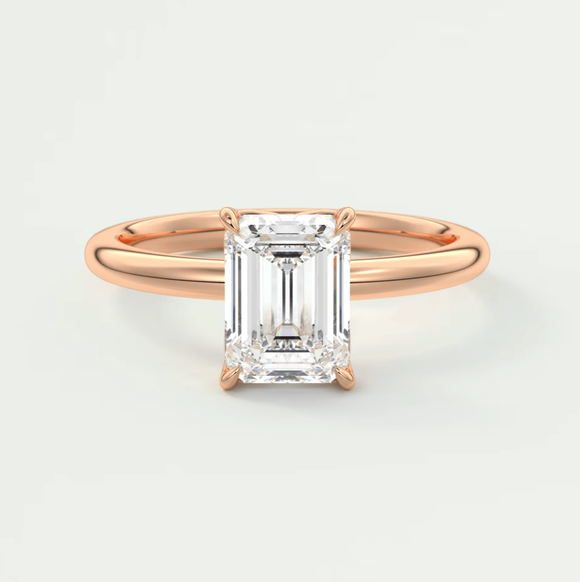 18k rose gold emerald cut diamond engagement ring.