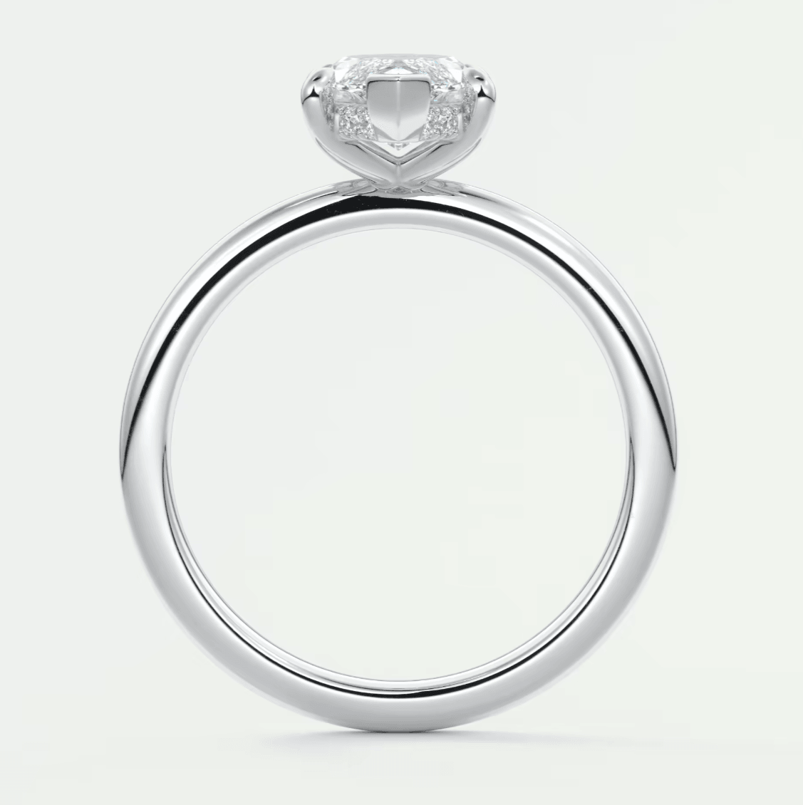18k white gold engagement ring with a cushion-cut diamond.
