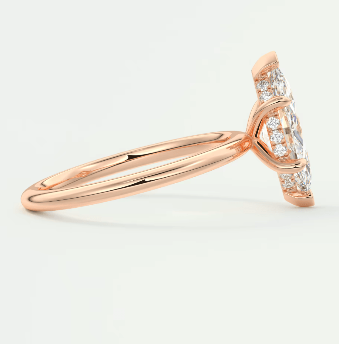 18k rose gold diamond engagement ring with a halo design.
