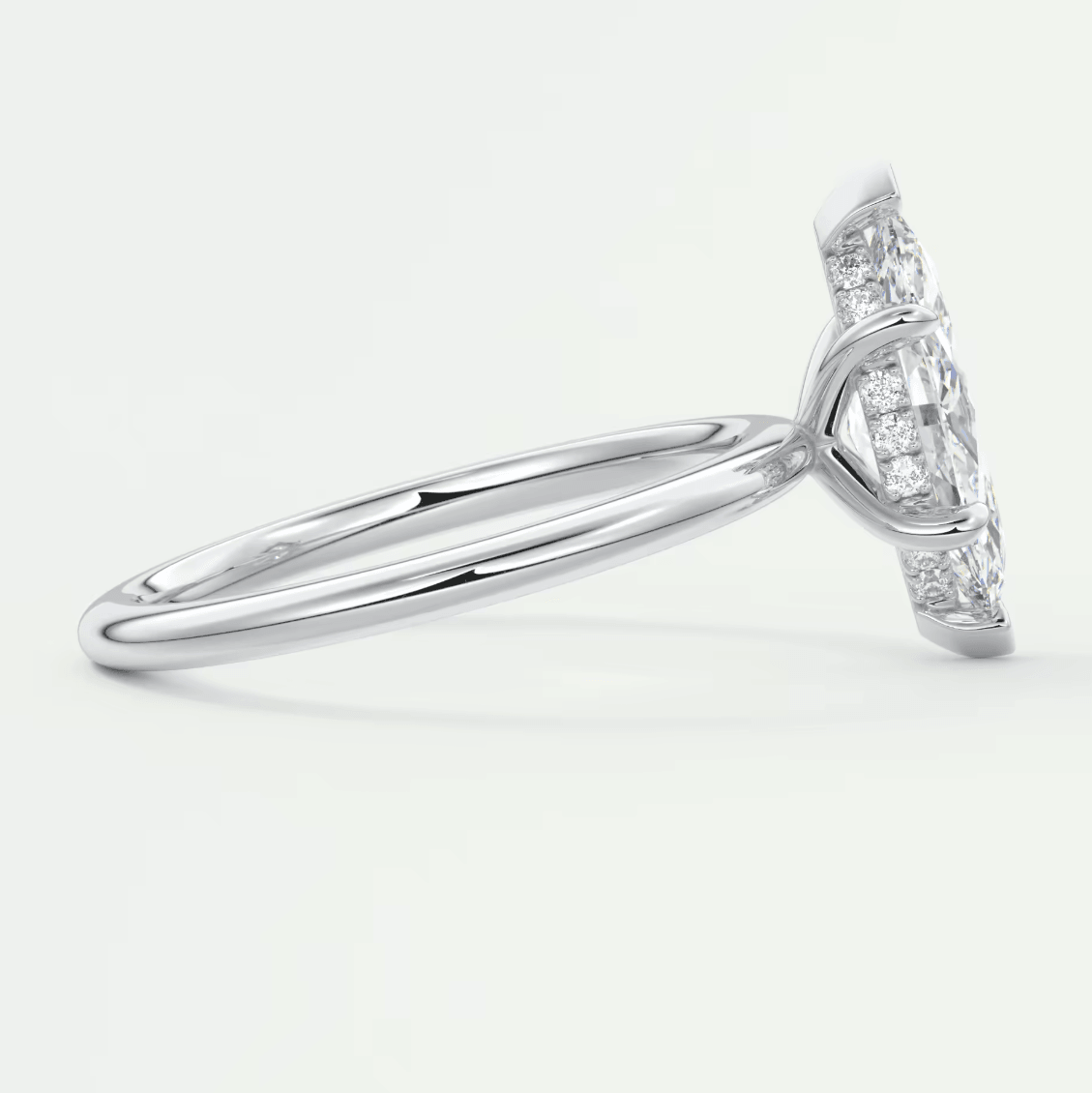 White diamond engagement ring with a princess cut center stone and pave set side stones, likely platinum or silver.