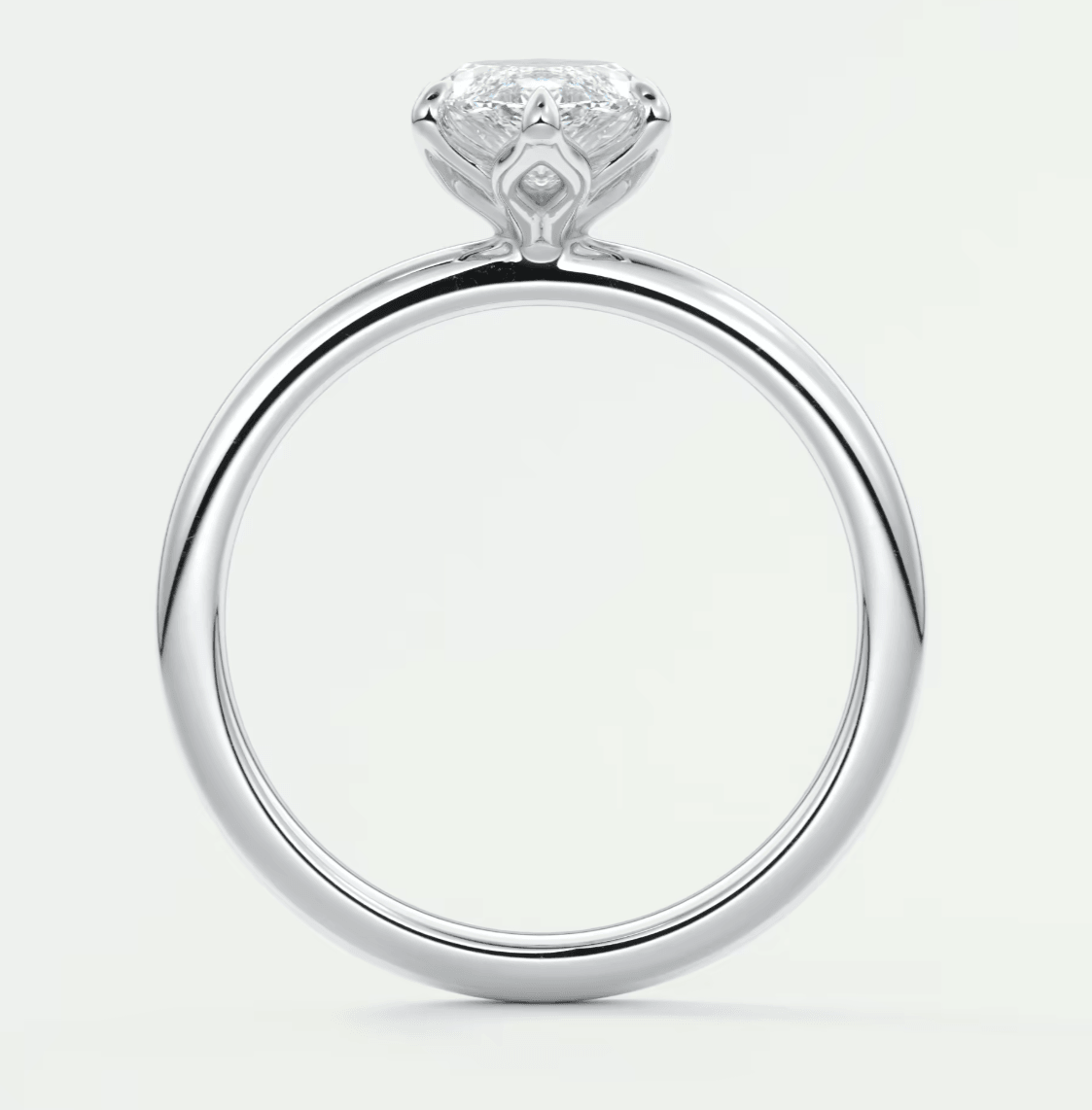 18k white gold engagement ring with a princess cut diamond.