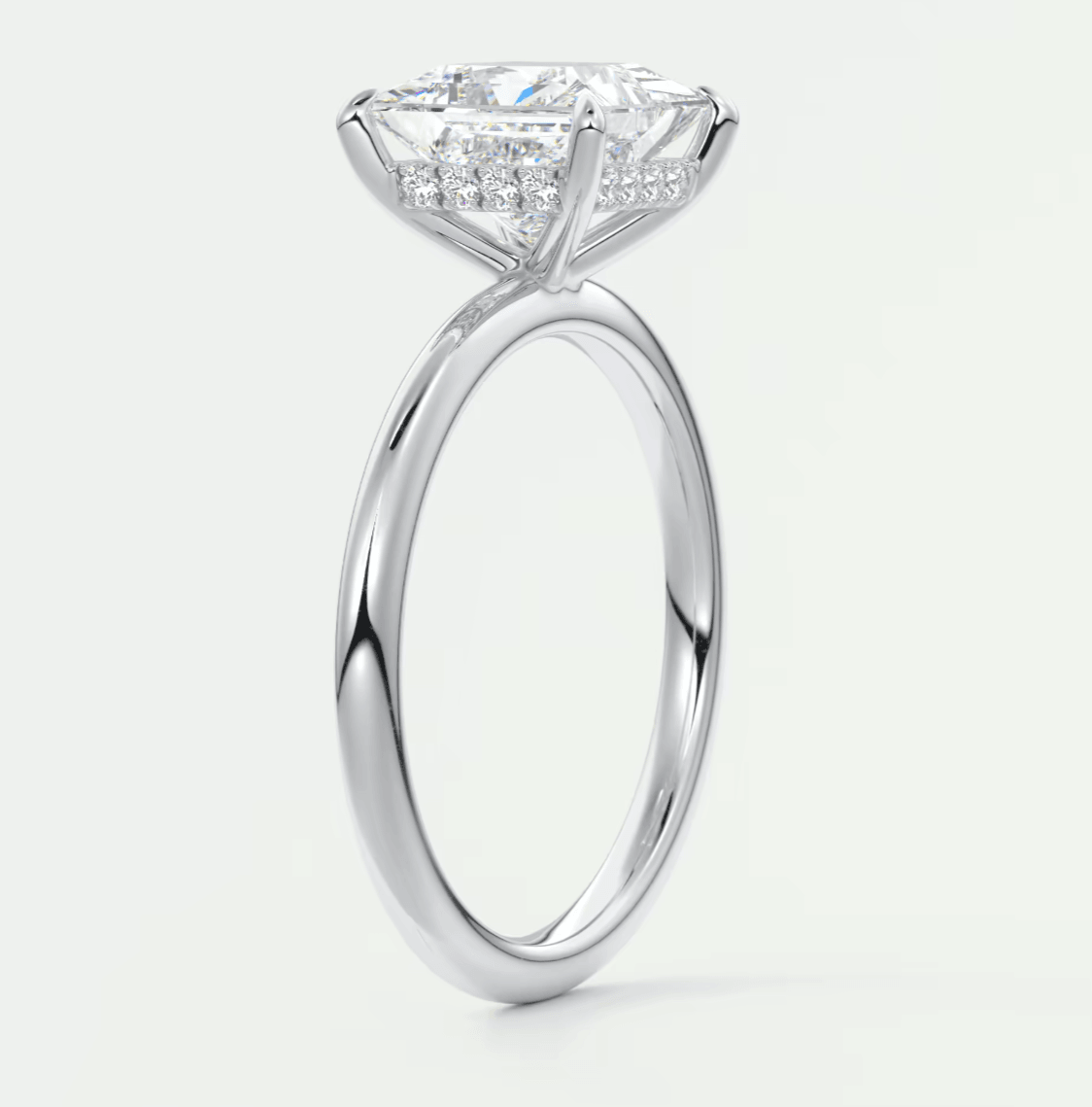 18k white gold engagement ring with princess cut diamond and halo design.