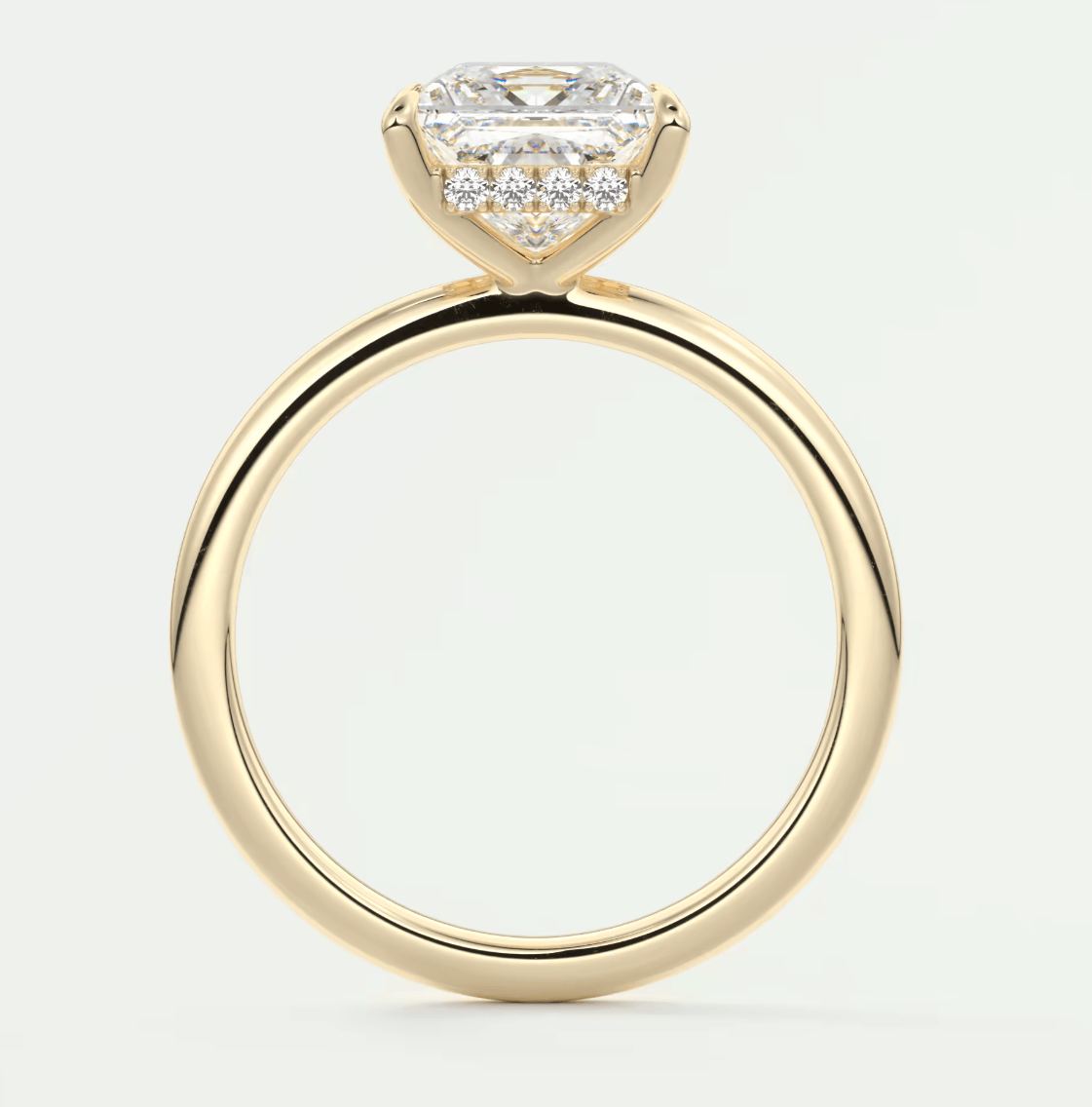 Princess cut diamond engagement ring with halo setting, yellow gold band