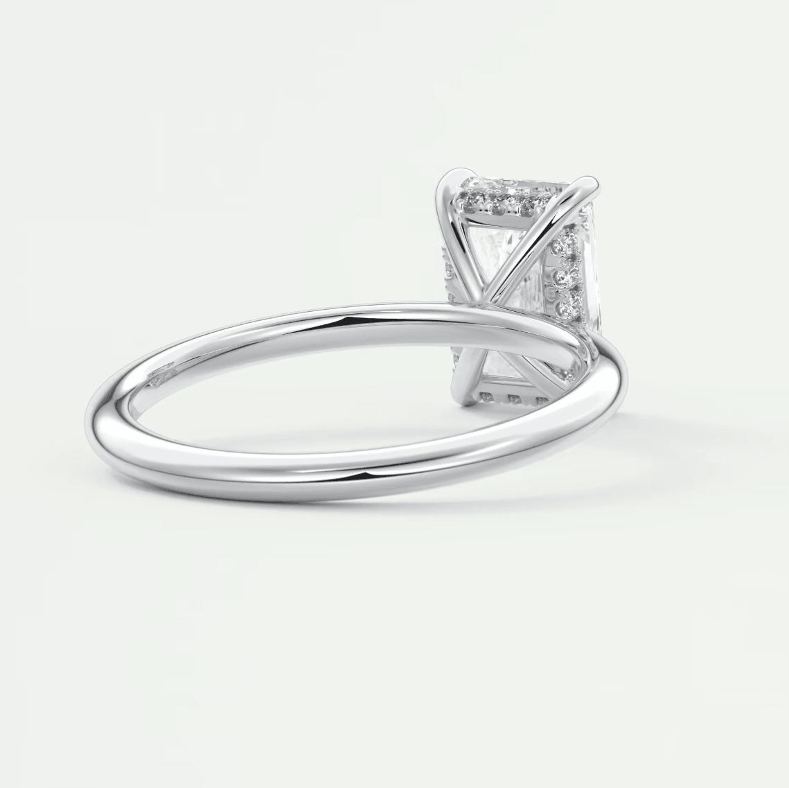 18k white gold diamond engagement ring with a princess cut center stone and pave set diamonds on the band.