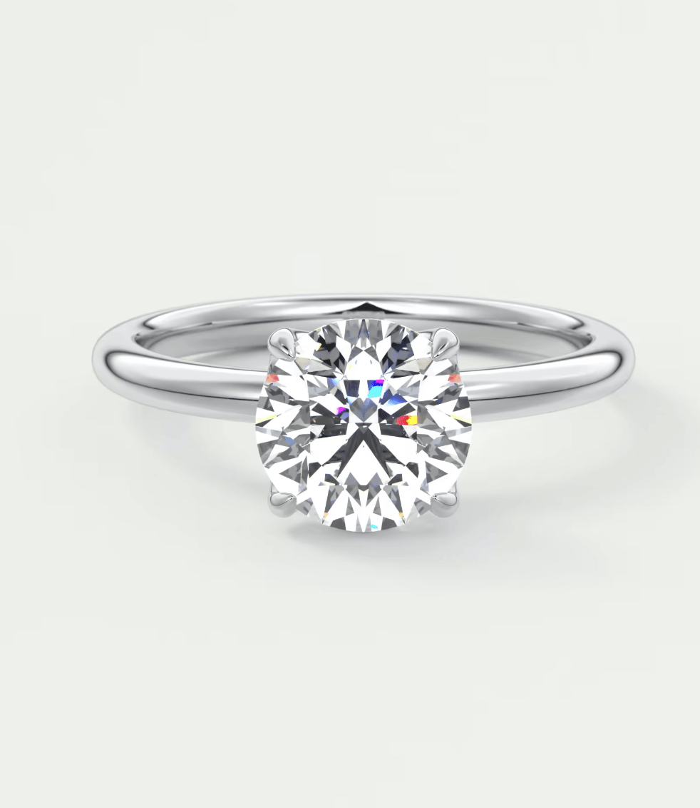18-karat white gold solitaire diamond engagement ring with a round brilliant cut.