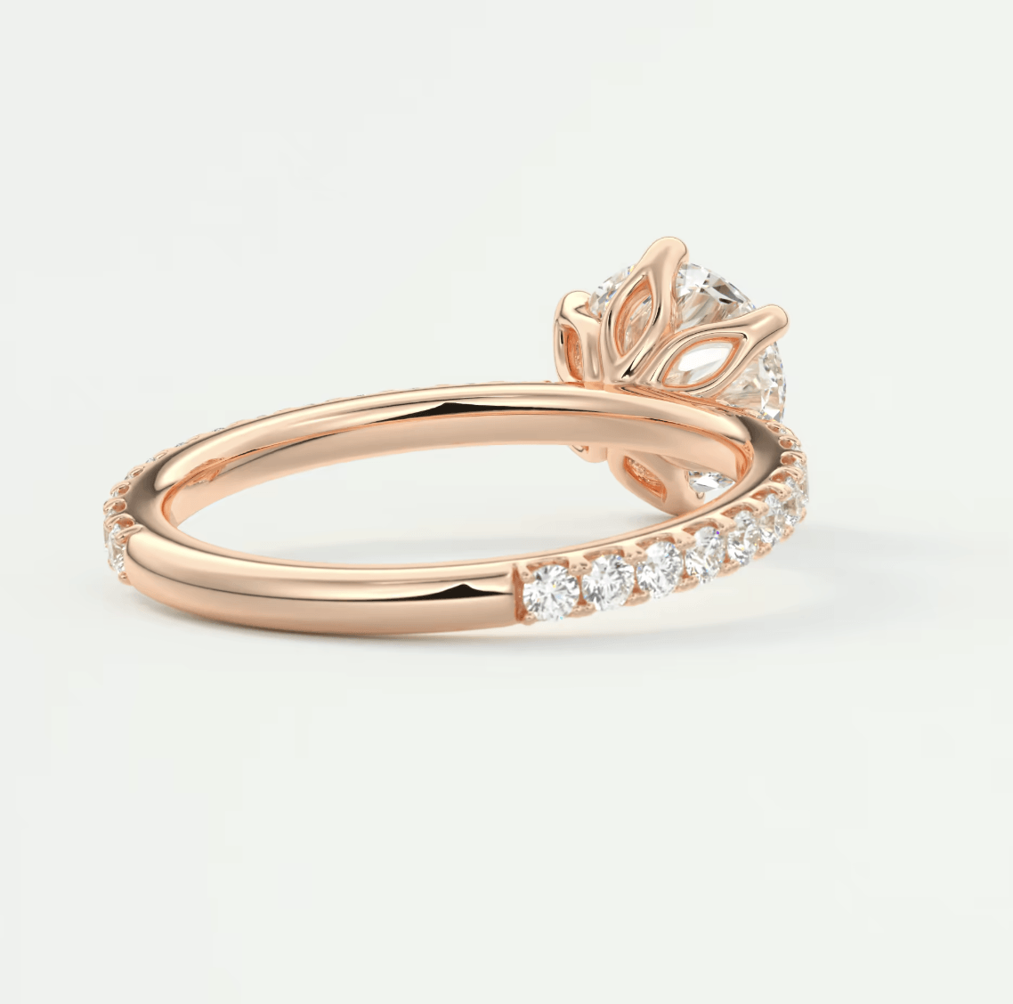 18k rose gold diamond engagement ring with a floral design.