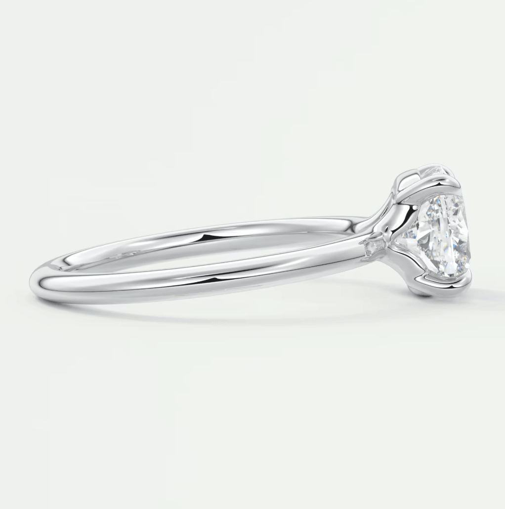 18-karat white gold solitaire diamond engagement ring.