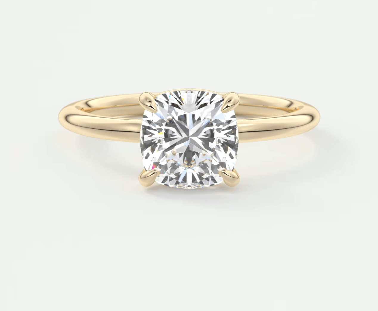 18k yellow gold cushion-cut diamond engagement ring.