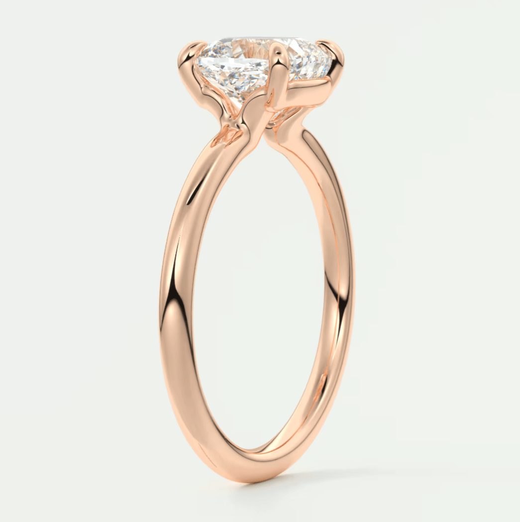Rose gold princess cut diamond engagement ring with a twisted band design.