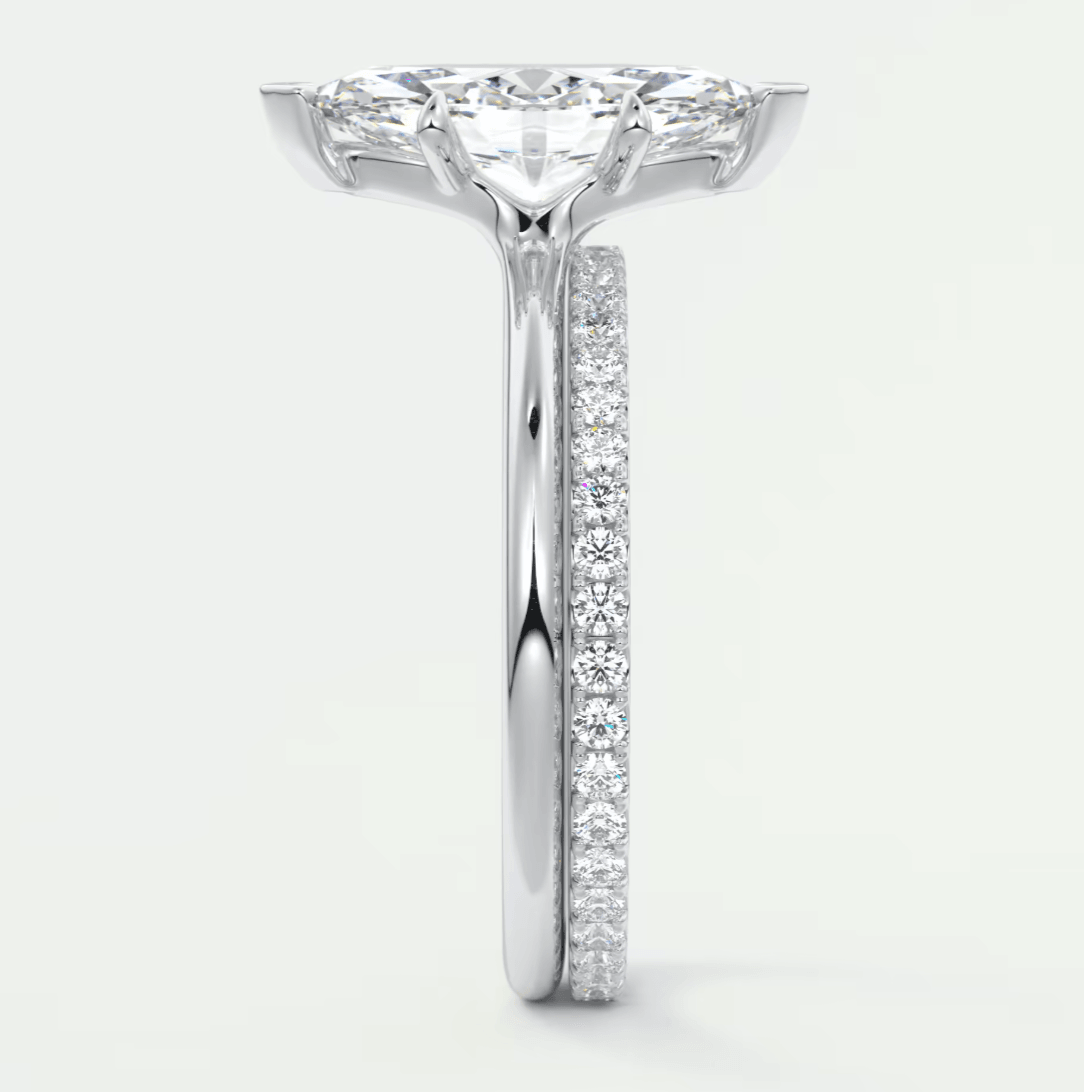 18k white gold diamond engagement ring with a princess cut center stone and pave set diamonds on the band.