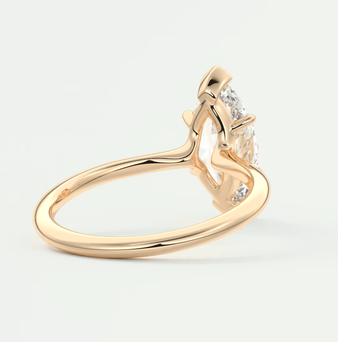 18-karat rose gold engagement ring with a princess-cut diamond.