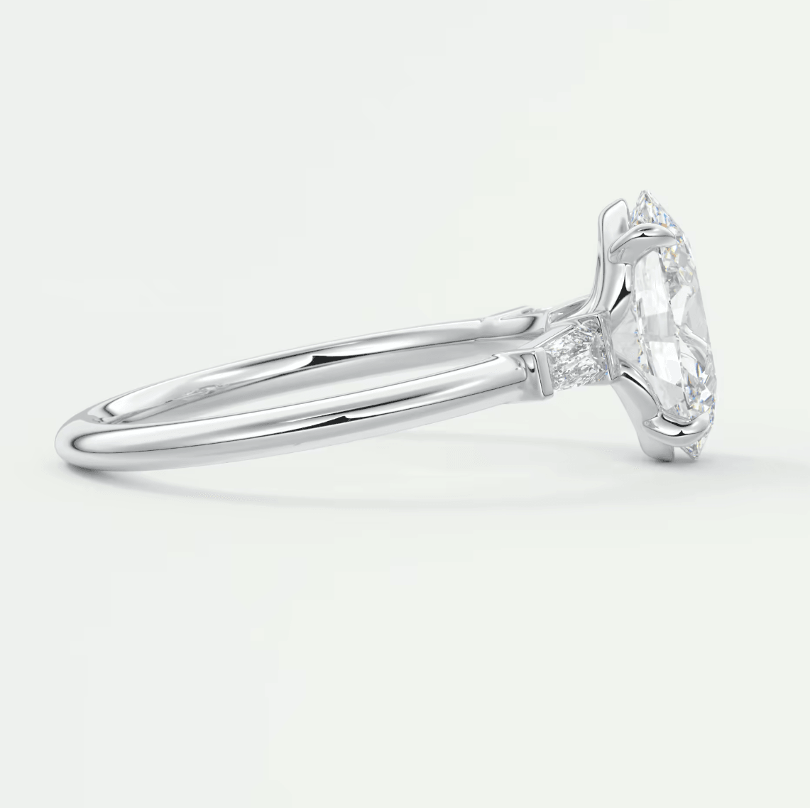 18-karat white gold engagement ring with a round diamond center stone and small diamonds on the band.
