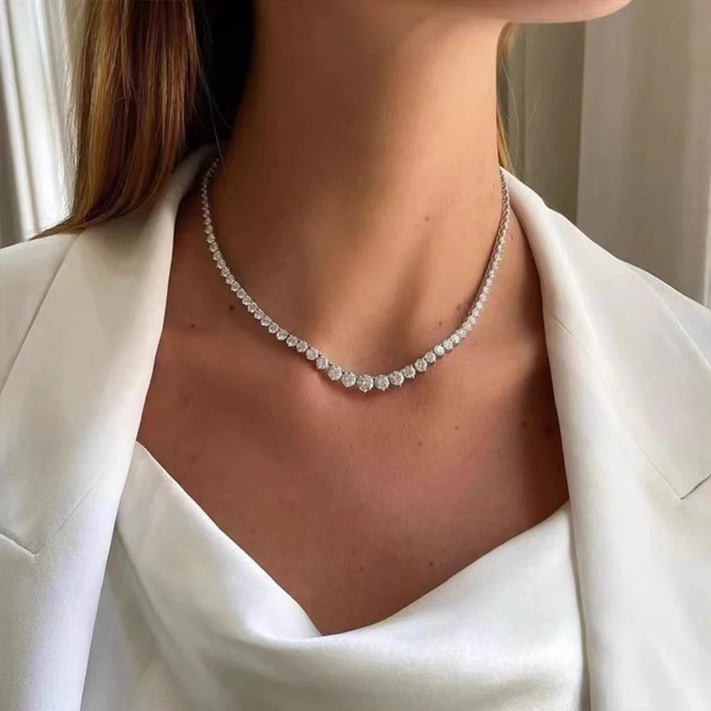 Tennis necklace on a women neck in white dress