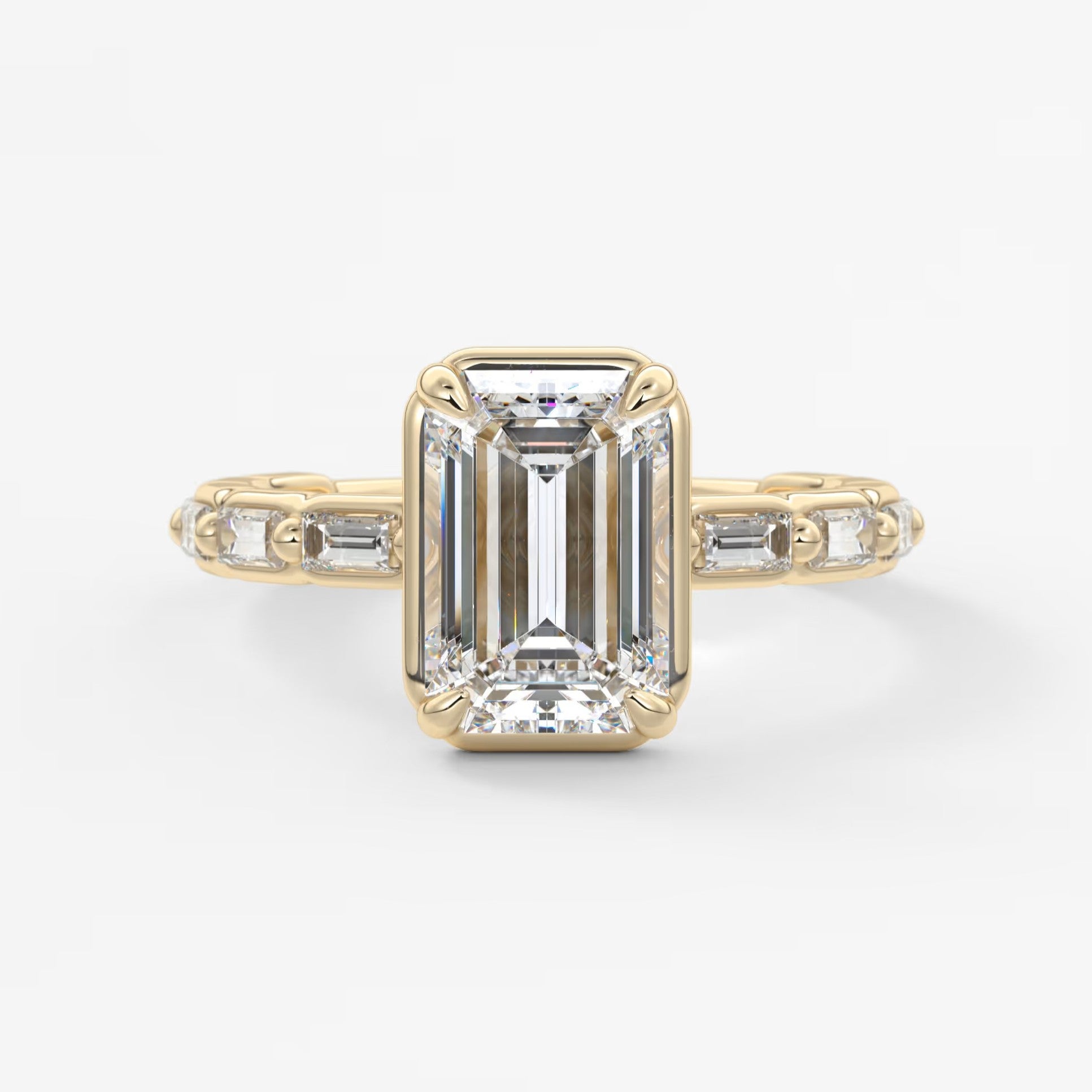 Isadora emerald bezel baguette engagement ring